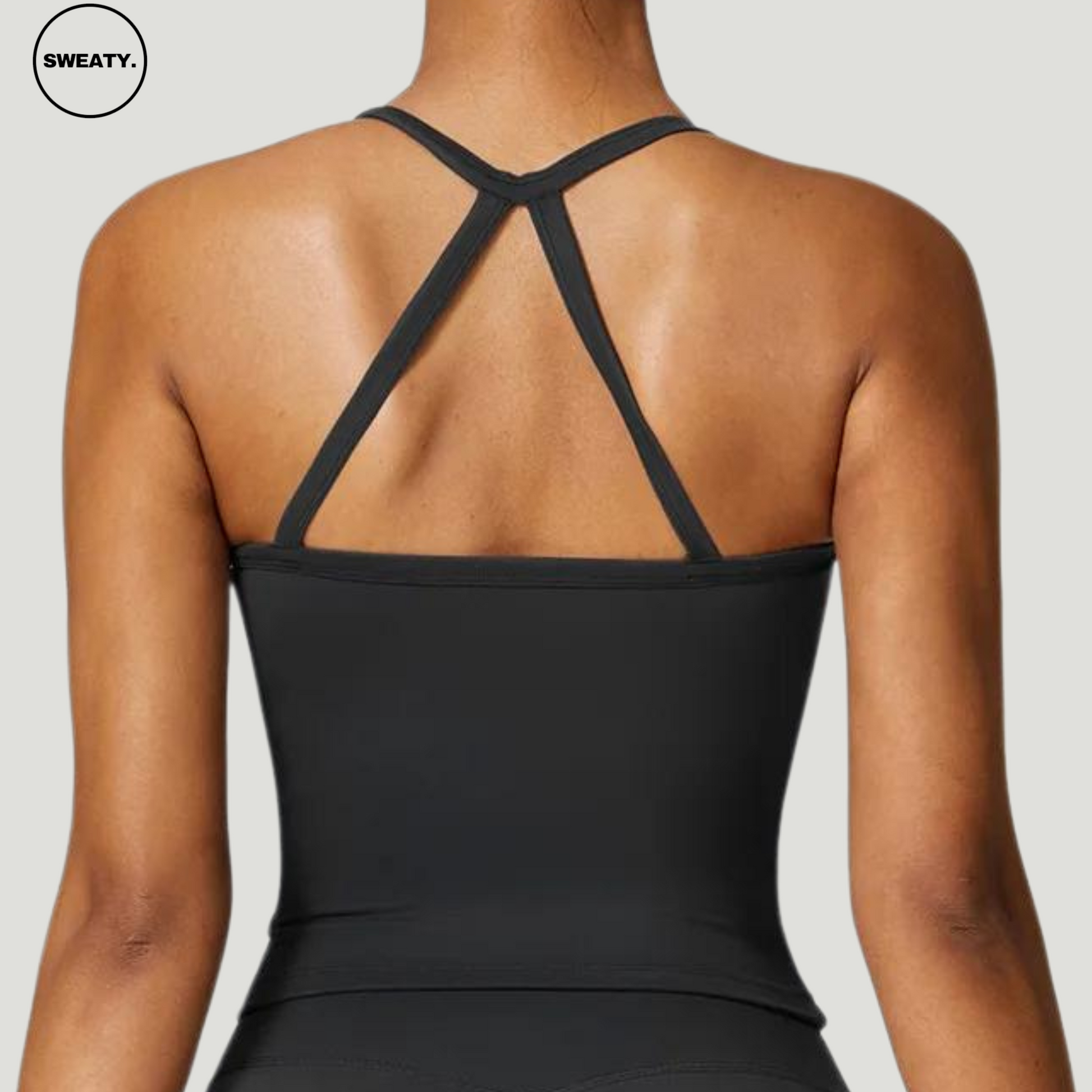 Advanced Black Push-Up Gym Bra Top by SWEATY - Back view featuring a strappy crisscross design. High-quality moisture-wicking fabric ensures comfort during workouts, with anti-shake technology and removable chest pads for extra support. Ideal for yoga, running, and fitness.