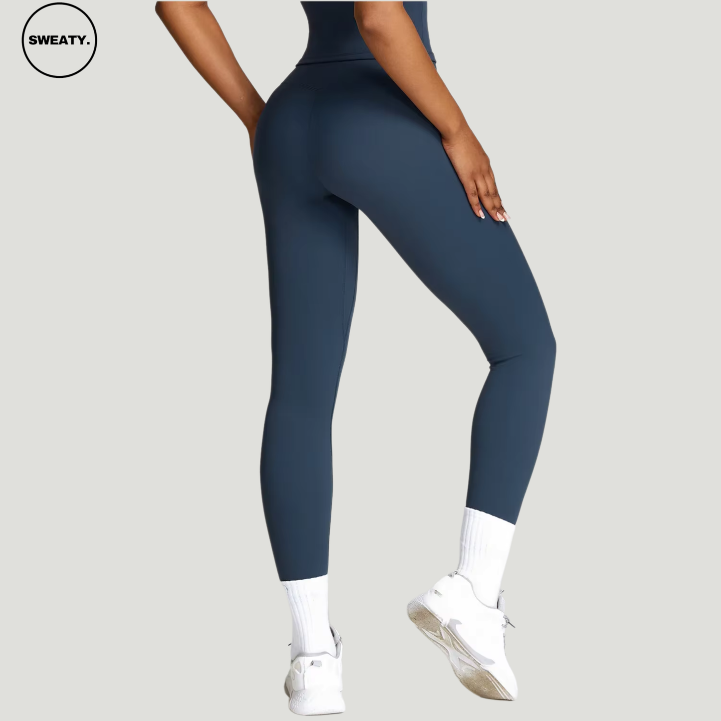 Badge blue seamless yoga set by SWEATY - Women's close-up back view, featuring a snug fit ideal for fitness, yoga, and everyday workouts. SWEATY activewear made from quick-dry fabric for superior comfort during exercise.