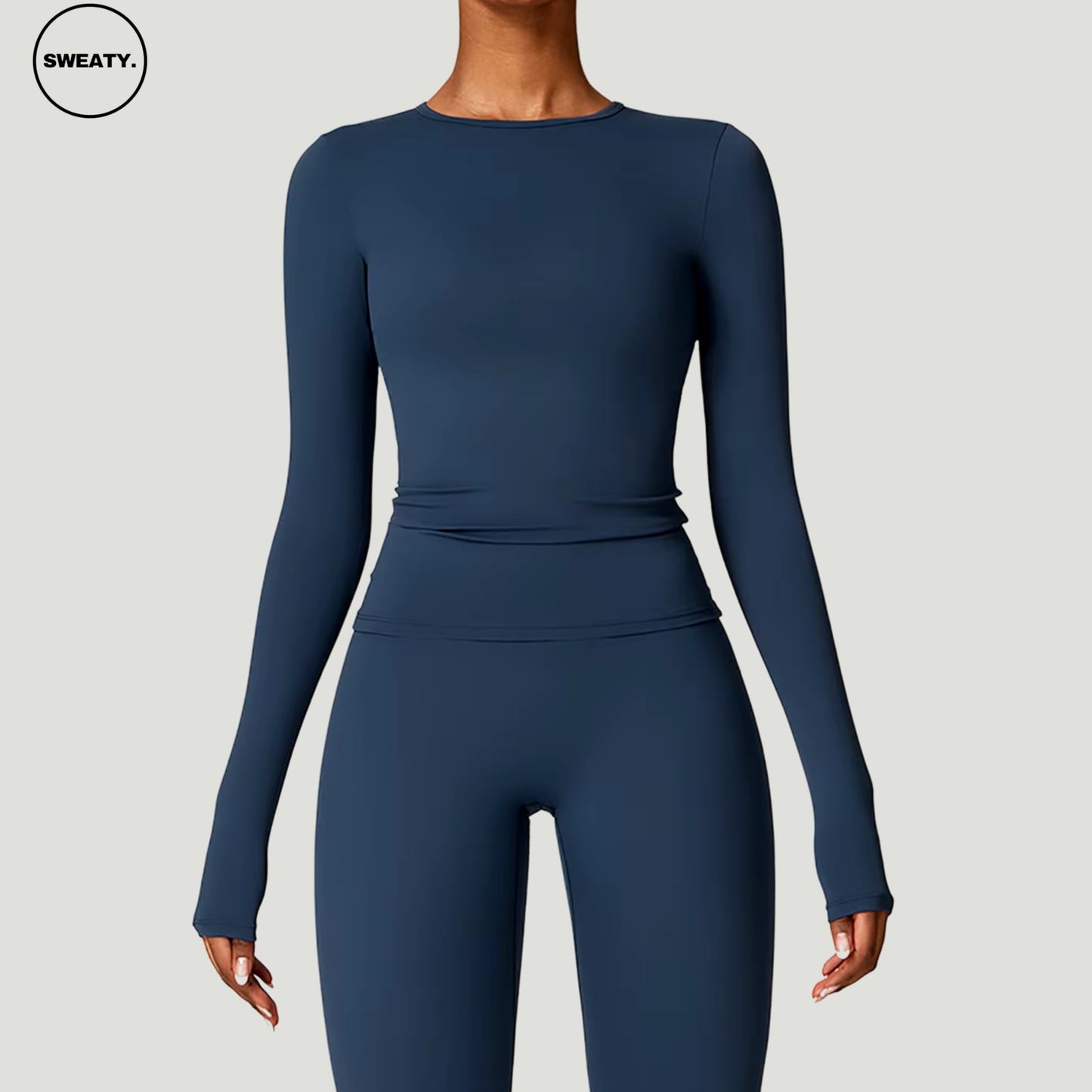 Badge blue seamless yoga set with long sleeves by SWEATY - Women's close-up front view showcasing a snug, body-hugging fit ideal for yoga, running, and fitness. SWEATY activewear designed with quick-dry fabric for optimal performance and comfort.