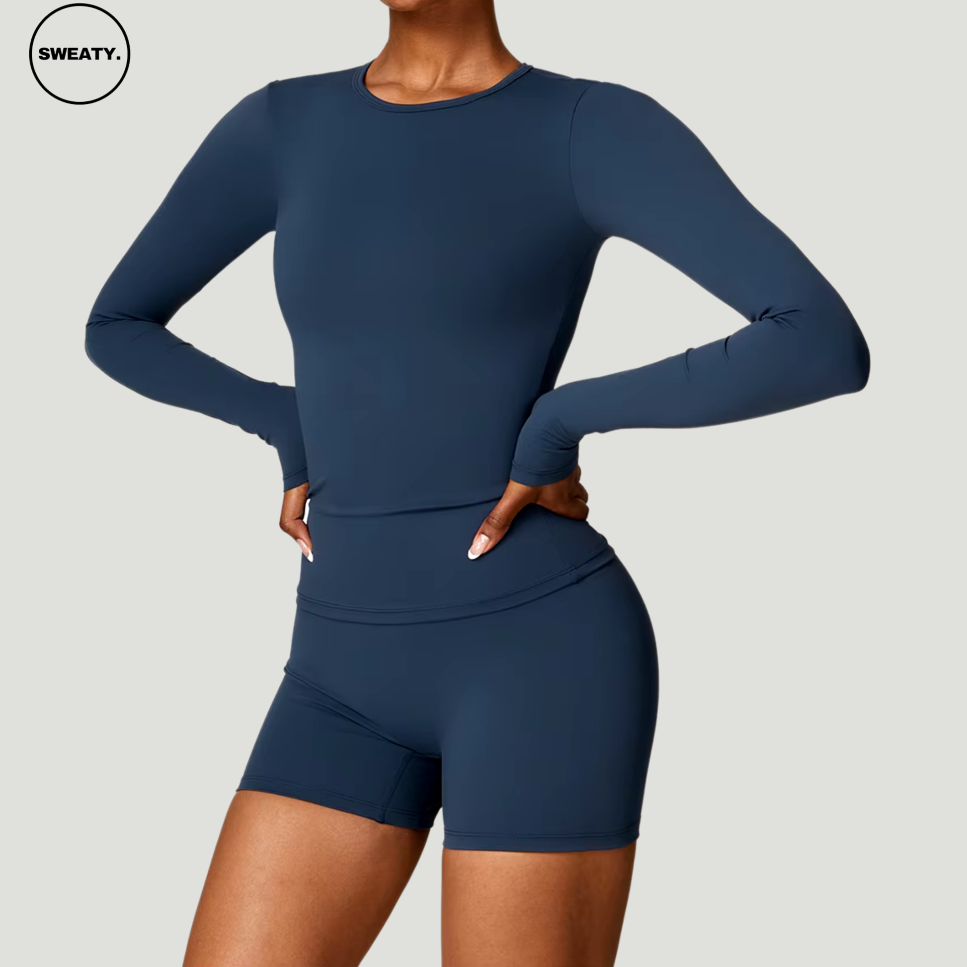 Badge blue seamless yoga set with long sleeves by SWEATY - Women's side view highlighting the flexible and comfortable design, ideal for yoga and activewear. SWEATY activewear made from moisture-wicking and quick-dry fabric for enhanced performance.