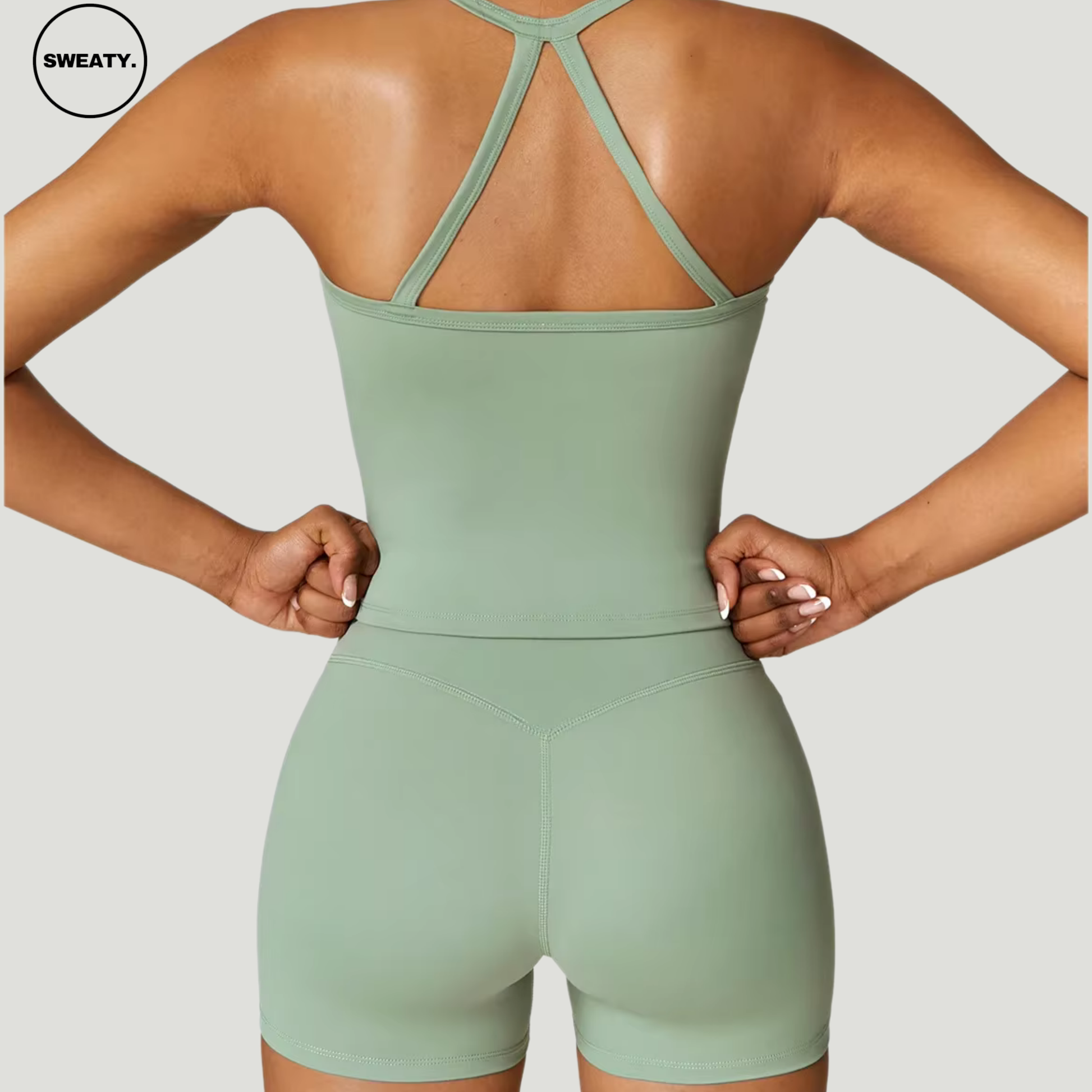 Basil green seamless yoga set by SWEATY - Women's back view showcasing the sleek and flexible fit, ideal for yoga and fitness activities. SWEATY activewear designed with moisture-wicking fabric for optimal comfort during workouts.