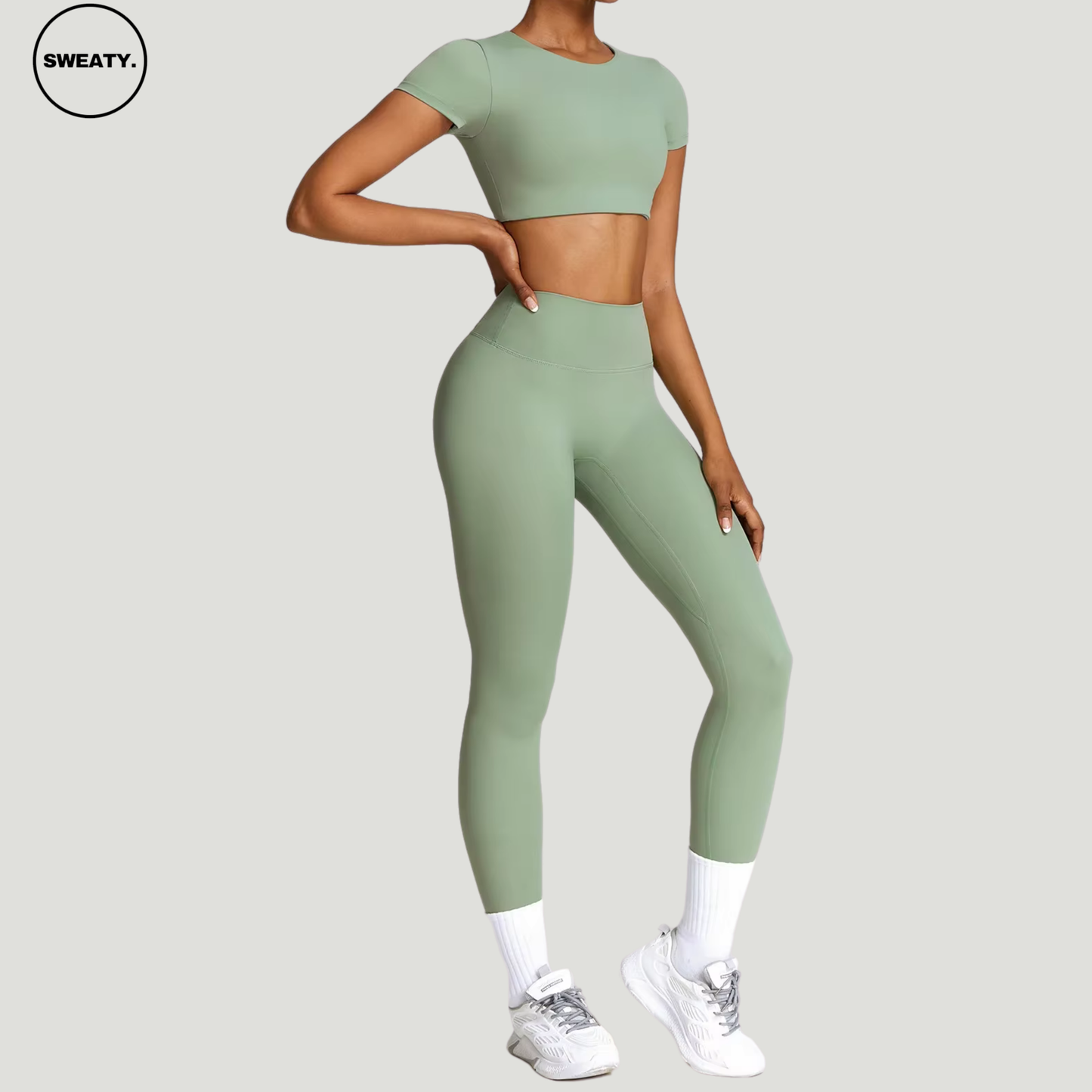 Basil green seamless yoga set with a cropped top by SWEATY - Women's side view highlighting a flexible and breathable design. Perfect for yoga, running, and fitness. Lightweight SWEATY activewear crafted with quick-dry fabric for enhanced comfort.