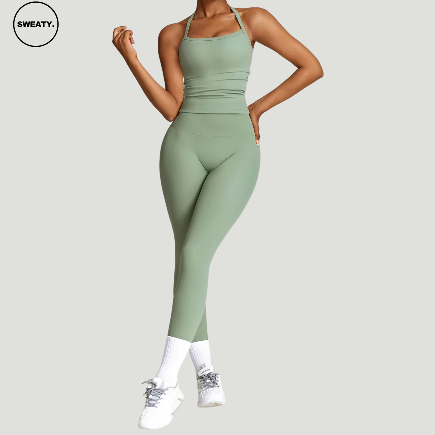 Basil green seamless yoga set by SWEATY - Women's front pose view highlighting the smooth and flexible fit, ideal for yoga, fitness, and everyday wear. SWEATY activewear crafted with moisture-wicking fabric for enhanced comfort.