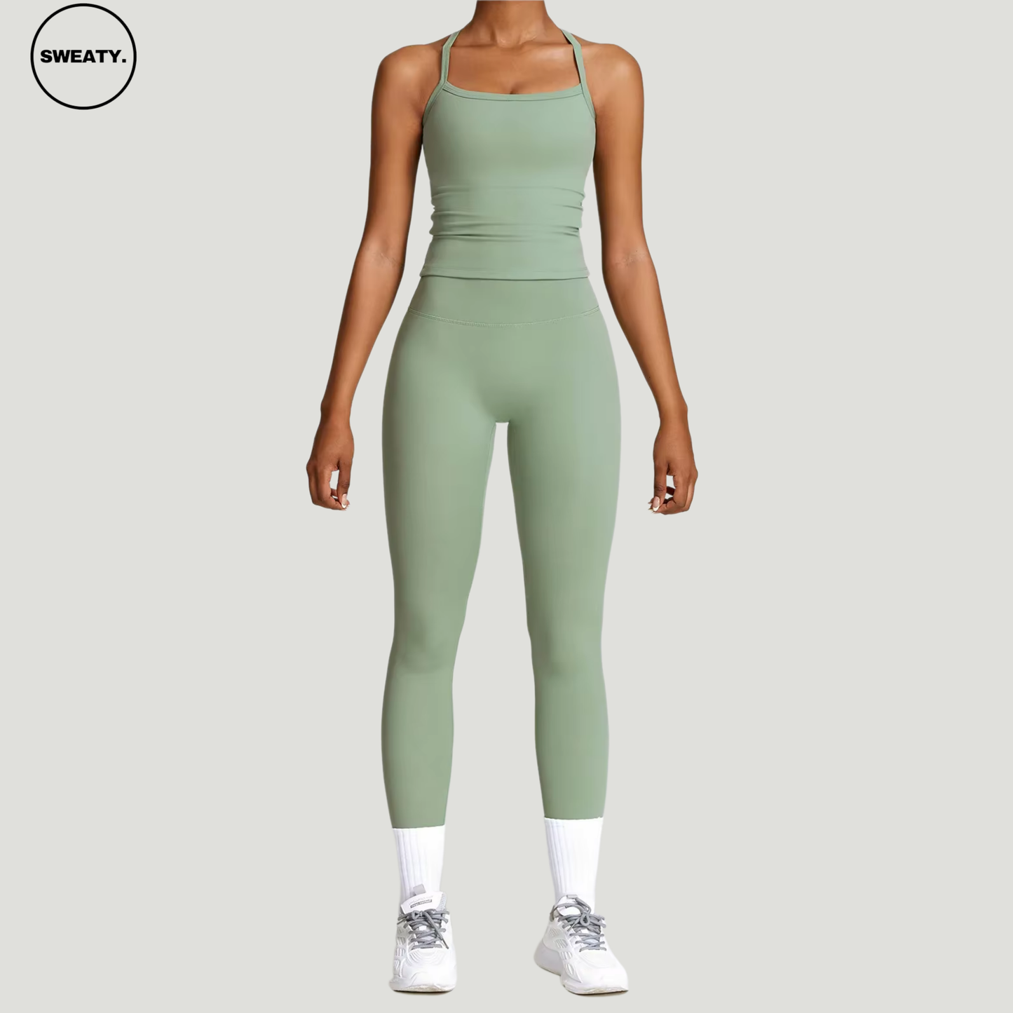 Basil green seamless yoga set by SWEATY - Women's front view showcasing a sleek and flexible design. Ideal for yoga, fitness, and activewear. SWEATY activewear made with breathable and moisture-wicking fabric for superior comfort.