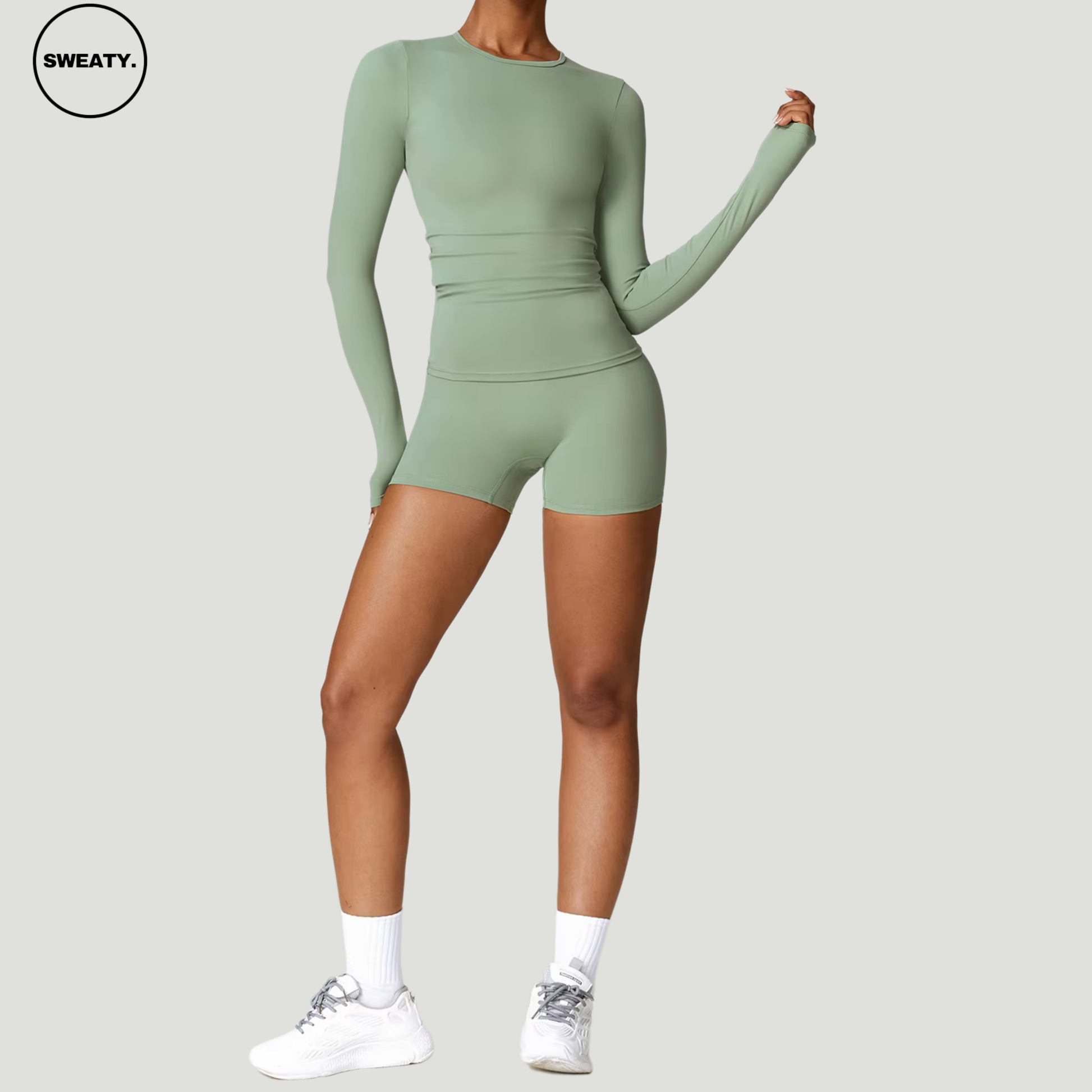 Basil green seamless yoga set with long sleeves by SWEATY - Women's full front view showing a sleek, body-hugging design, perfect for yoga, gym, and fitness. SWEATY activewear crafted from quick-dry fabric for superior comfort and performance.