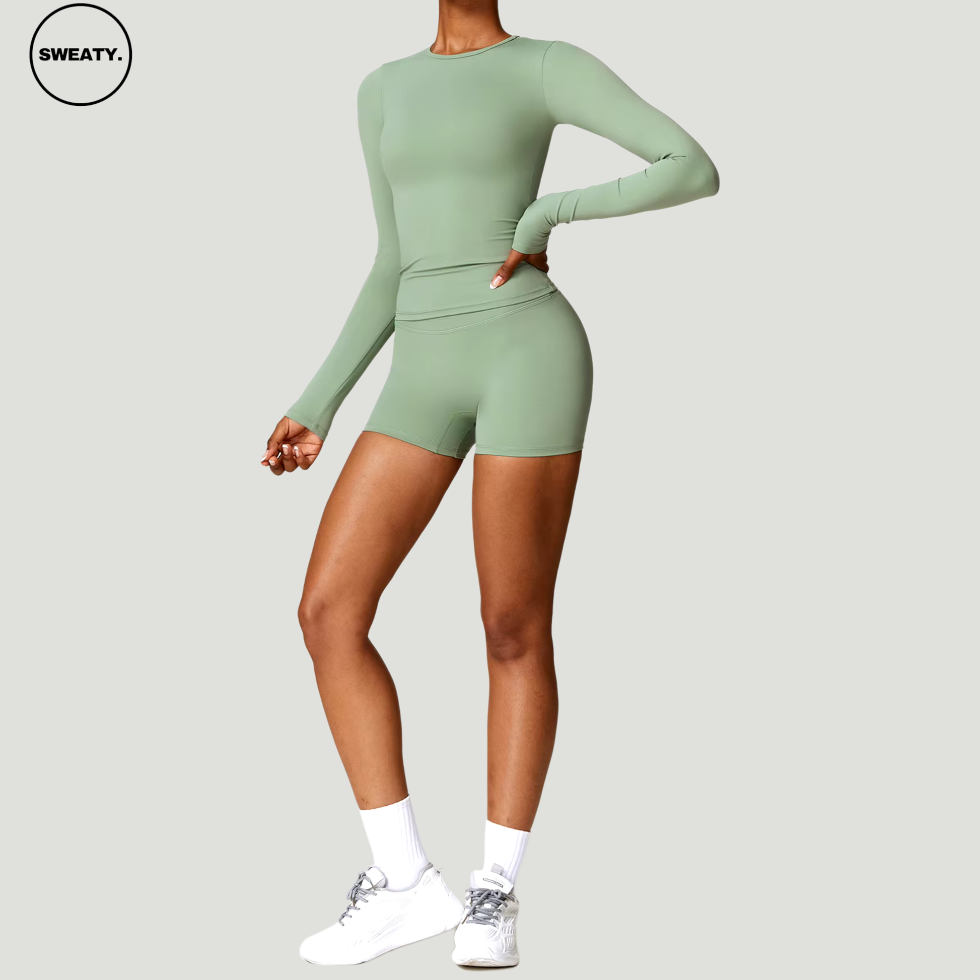 Basil green seamless yoga set with long sleeves by SWEATY - Women's side view highlighting a flexible and breathable fit, ideal for yoga, running, and activewear. SWEATY activewear made from moisture-wicking fabric for optimal performance.