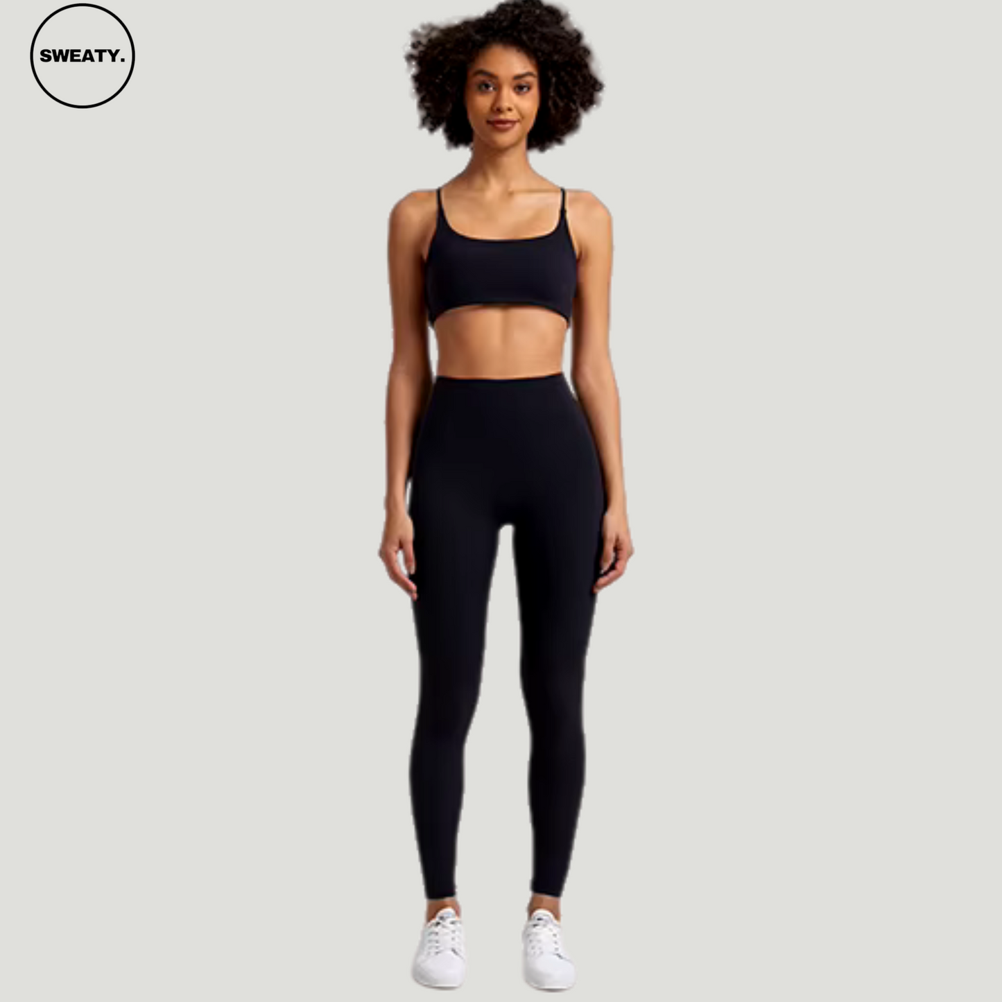 Black-Buttery-Soft-Gym-Set-Front-View-by-SWEATY - Women's bold and vibrant black-buttering leggings and sports bra, featuring an elegant cross-back design for enhanced support and style during fitness activities. Perfect for those looking to stand out in the gym with both color and performance.