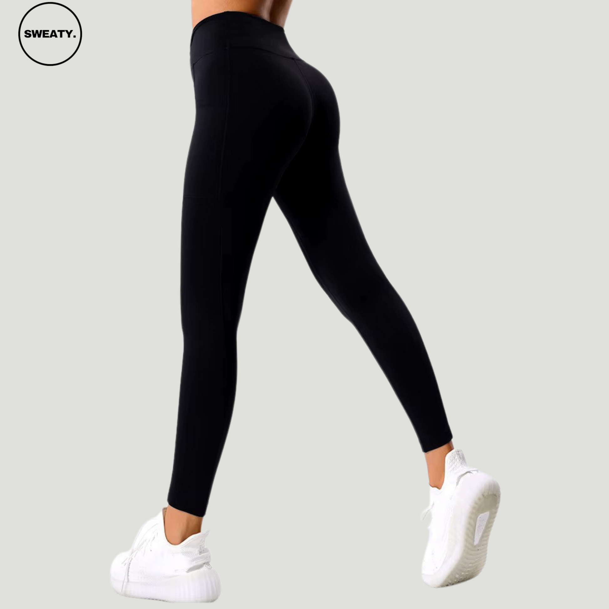 Back view of the Black Hips Yoga Legging by SWEATY, highlighting the seamless design and contoured fit. The high-waisted leggings offer full coverage and support, with side pockets and a flattering, form-fitting style perfect for yoga, gym sessions, and casual wear.