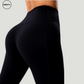 Close-up of the Black Hips Yoga Legging by SWEATY, showcasing the high-waisted design and contoured seam detailing. The fabric hugs the body for a sleek, form-fitting look, perfect for enhancing movement during yoga or workout sessions.