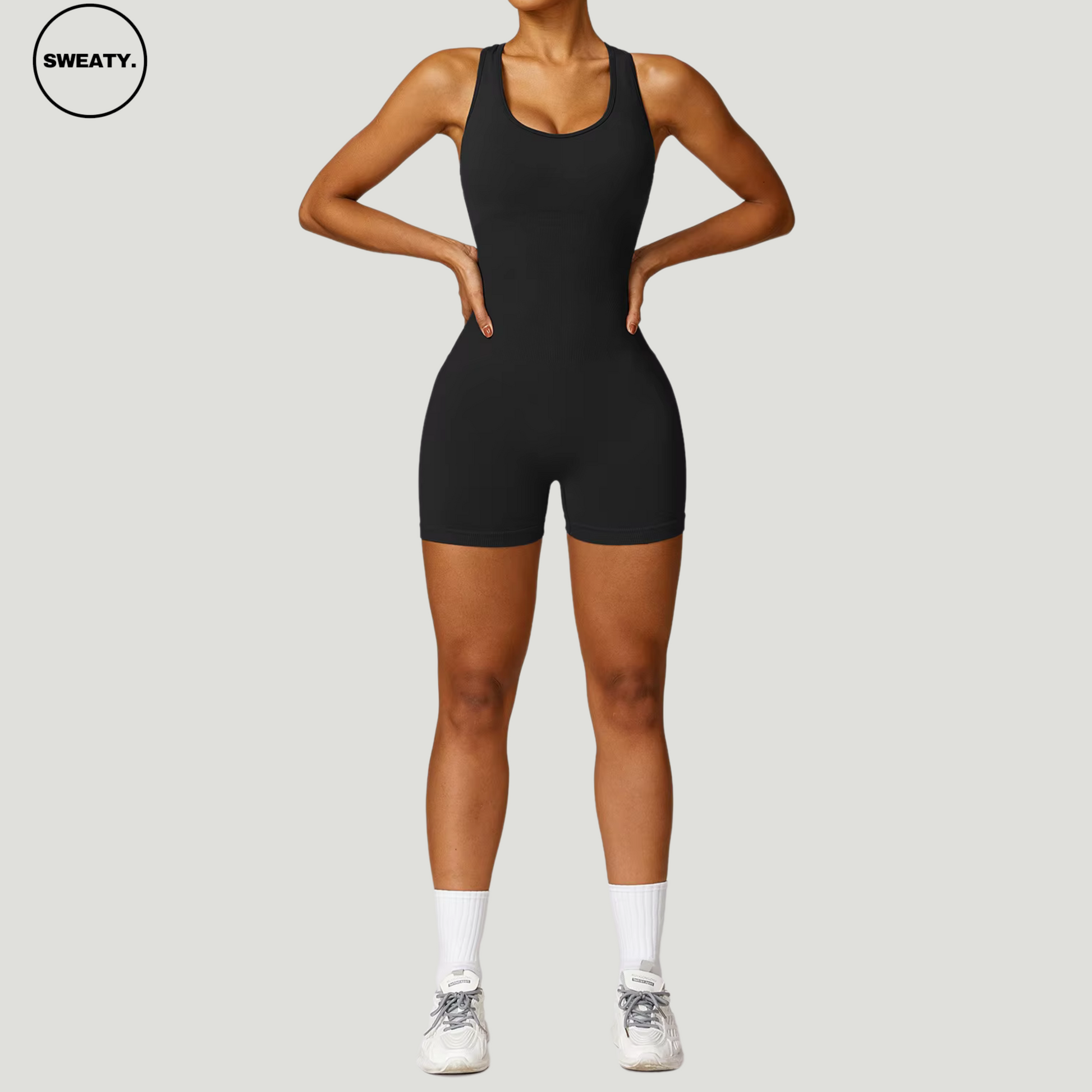 Black Seamless Gym Shortie Jumpsuit by SWEATY - Women's body-hugging, breathable jumpsuit designed for fitness and gym workouts. SWEATY activewear with seamless construction for enhanced comfort and flexibility.