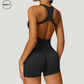 Side-back view of Black Seamless Gym Shortie Jumpsuit by SWEATY - Women's sleek, open-back jumpsuit designed for fitness, yoga, and running. Made from breathable, seamless fabric for unrestricted movement.