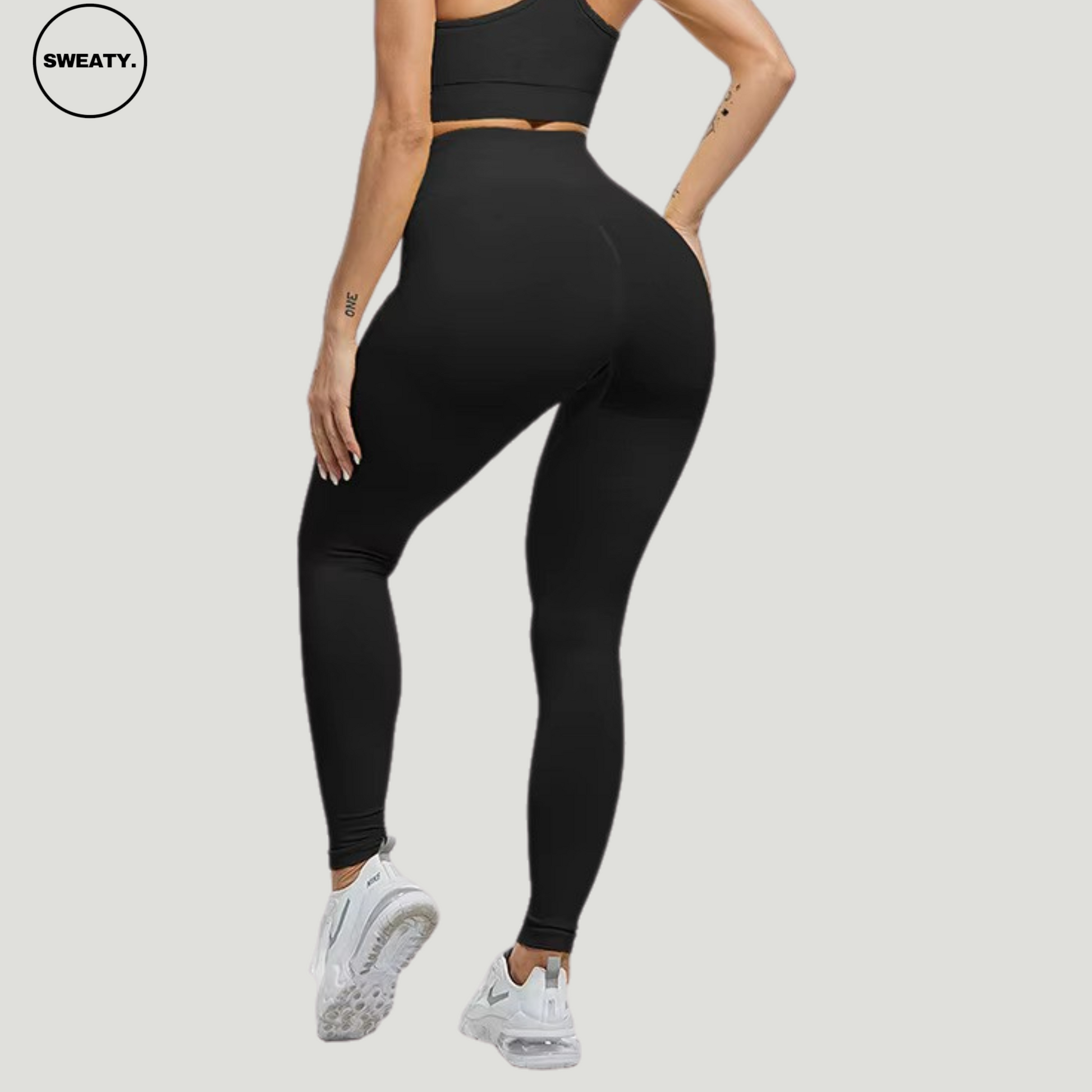 Back view of Black seamless high-waist leggings by SWEATY, showcasing the supportive and flattering fit perfect for activewear or casual style.