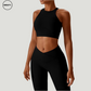 Black seamless sportswear set by SWEATY – close-up of the high-neck sports bra paired with high-waisted leggings. Moisture-wicking, breathable fabric for optimal comfort during workouts and yoga.