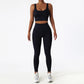 Black seamless tracksuit set by SWEATY - Women's high-waist leggings and sports bra made with breathable, moisture-wicking fabric. Perfect for yoga, running, and fitness, offering comfort and support during workouts.