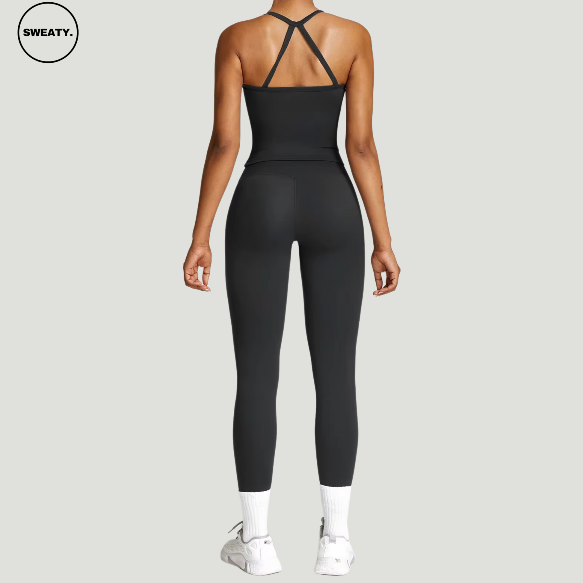 Black seamless yoga set by SWEATY - Women's workout set designed with a full-back view for maximum flexibility. Ideal for yoga, fitness, and activewear. SWEATY activewear featuring moisture-wicking and breathable fabric for optimal comfort during exercise.