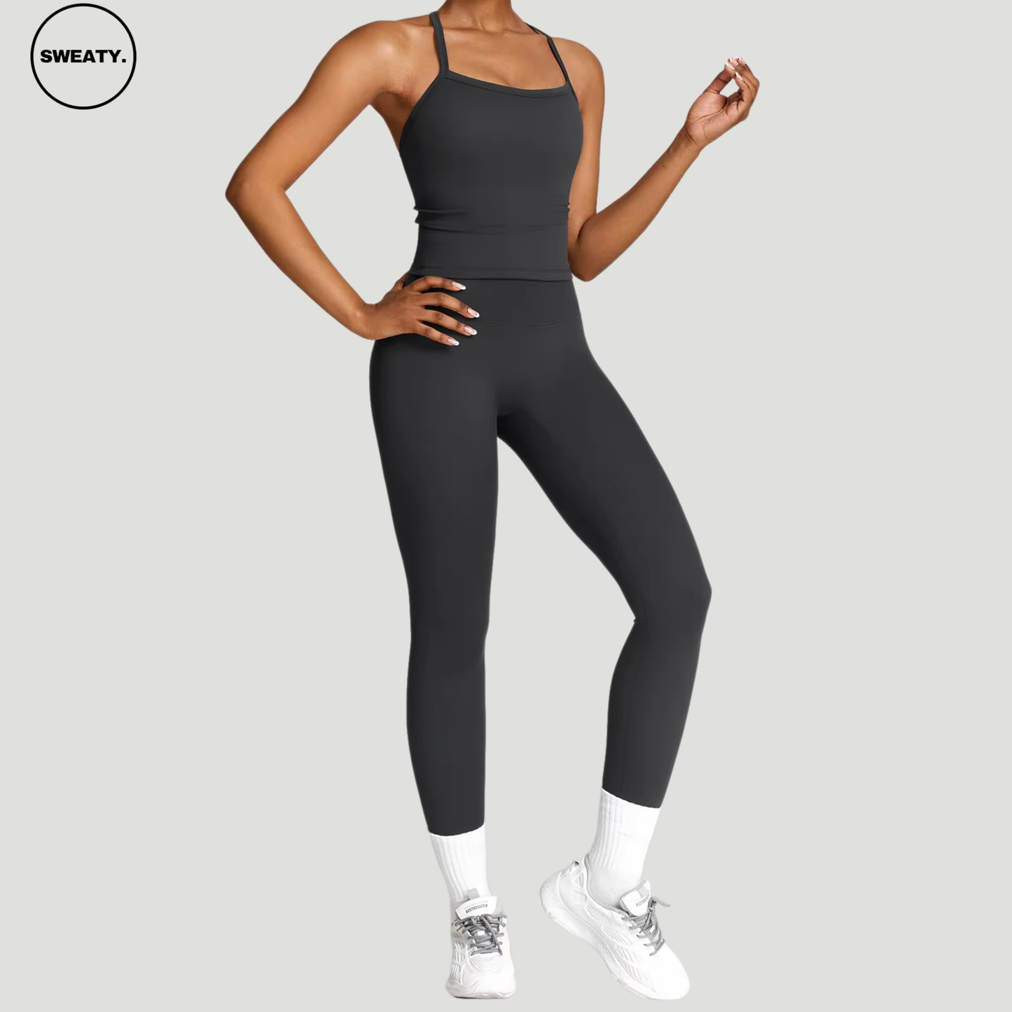 Black seamless yoga set by SWEATY - Women's side view showcasing a sleek and flexible fit. Designed for yoga, gym, and active fitness. SWEATY activewear crafted from moisture-wicking fabric for enhanced performance.