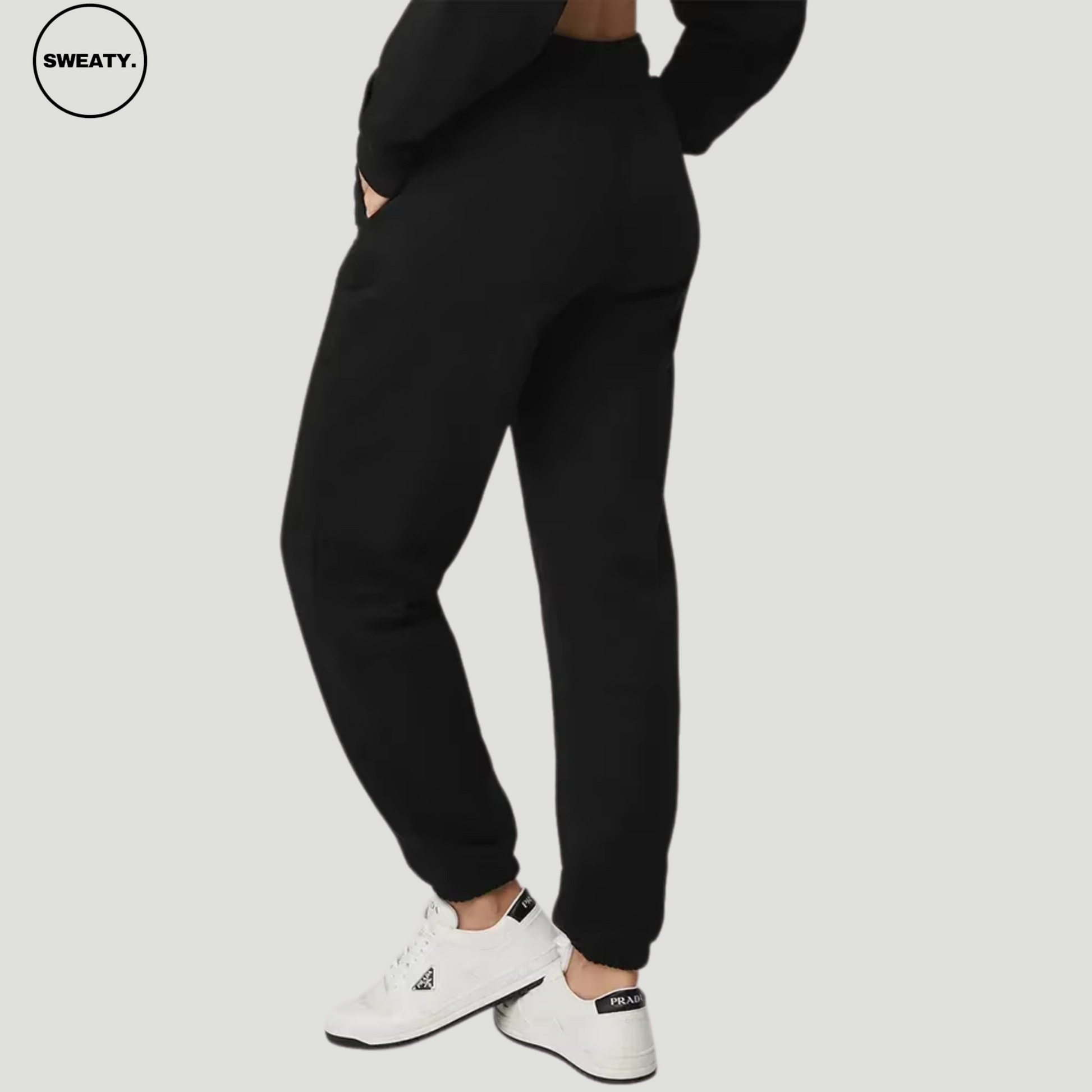 Black wide-leg fleece-lined sweatpants by SWEATY - Women's comfortable sweatpants featuring a back view, showing a relaxed fit and soft fleece lining. Designed for casual wear, lounging, or fitness. Elastic waistband and pockets offer functionality and style.