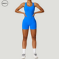 Blue seamless gym shortie jumpsuit by SWEATY - Women's front close-up view showcasing a seamless, figure-enhancing design. Ideal for gym workouts, this jumpsuit offers a comfortable and flexible fit with moisture-wicking fabric.