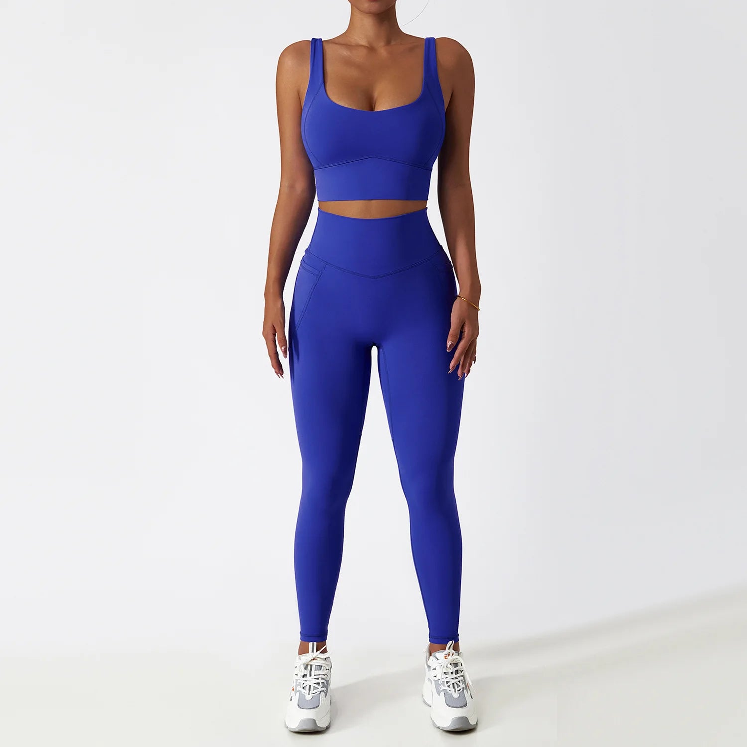 Blue seamless tracksuit set by SWEATY - Women's high-waist leggings and supportive sports bra, crafted with breathable and moisture-wicking fabric. Designed for yoga, running, and fitness activities, ensuring flexibility and comfort during workouts.