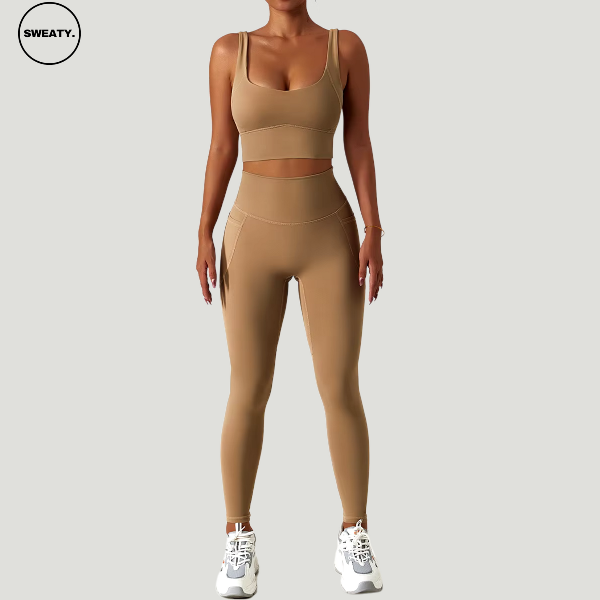 Front view of the brown seamless tracksuit set with trousers by SWEATY. Lightweight, moisture-wicking fabric perfect for yoga, fitness, and running activities. Designed for optimal comfort and performance.