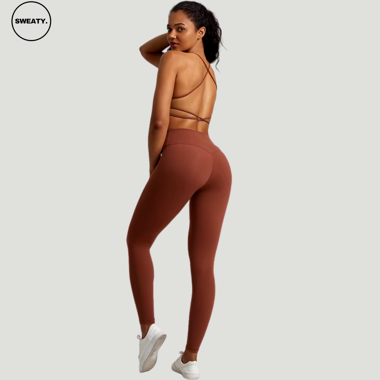 Chocolate_Brown___Buttery_Soft-Gym-Set-Side-View-by-SWEATY Women's bold and vibrant chocolate brown leggings and sports bra, featuring an elegant cross-back design for enhanced support and style during fitness activities. Perfect for those looking to stand out in the gym with both color and performance.