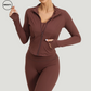 Coffee Three Piece Workout Set by SWEATY - Angled front view of women's fitness outfit, showcasing a sleek design with breathable, quick-drying fabric. Ideal for workouts, this set includes a long-sleeve jacket, sports bra, and leggings.