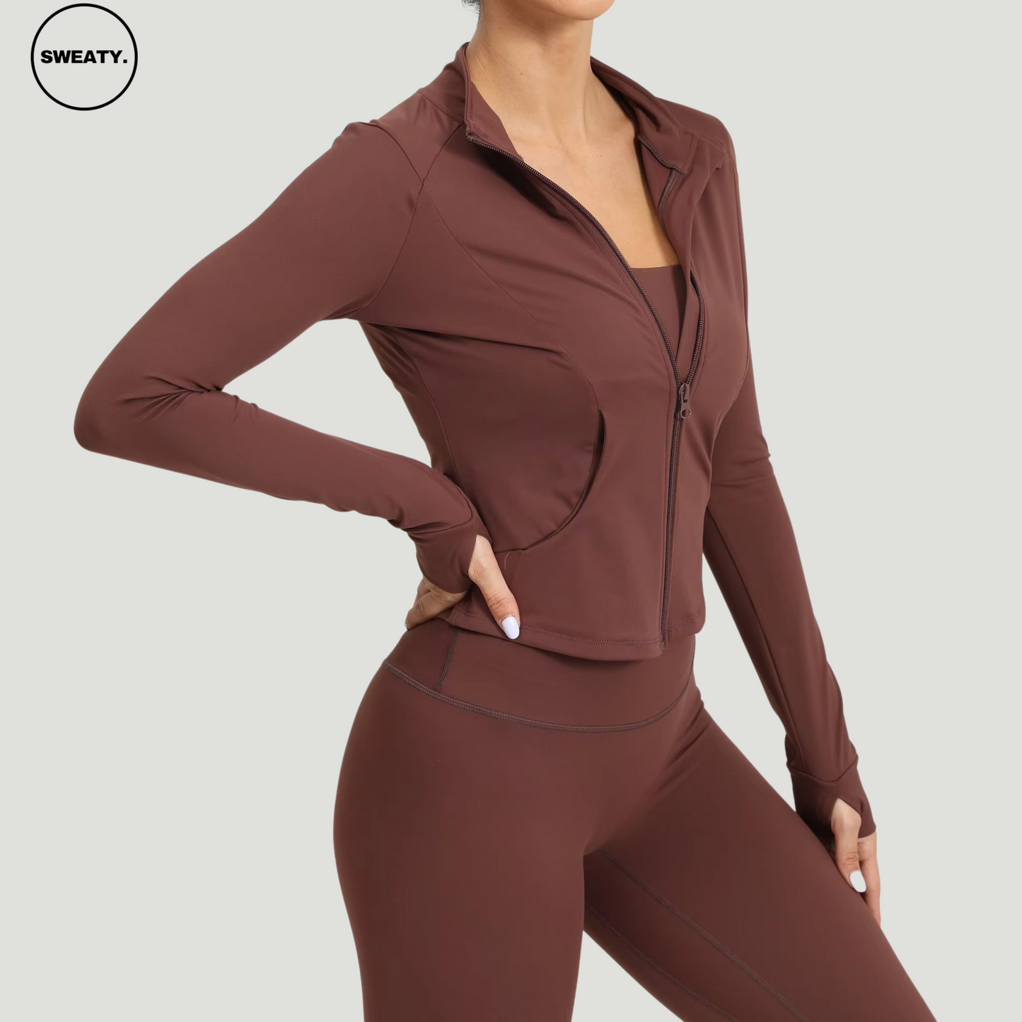 Coffee Three Piece Workout Set by SWEATY - Side view of women's seamless workout set designed with breathable, moisture-wicking fabric. Perfect for fitness activities like yoga or running, with a matching jacket, sports bra, and leggings