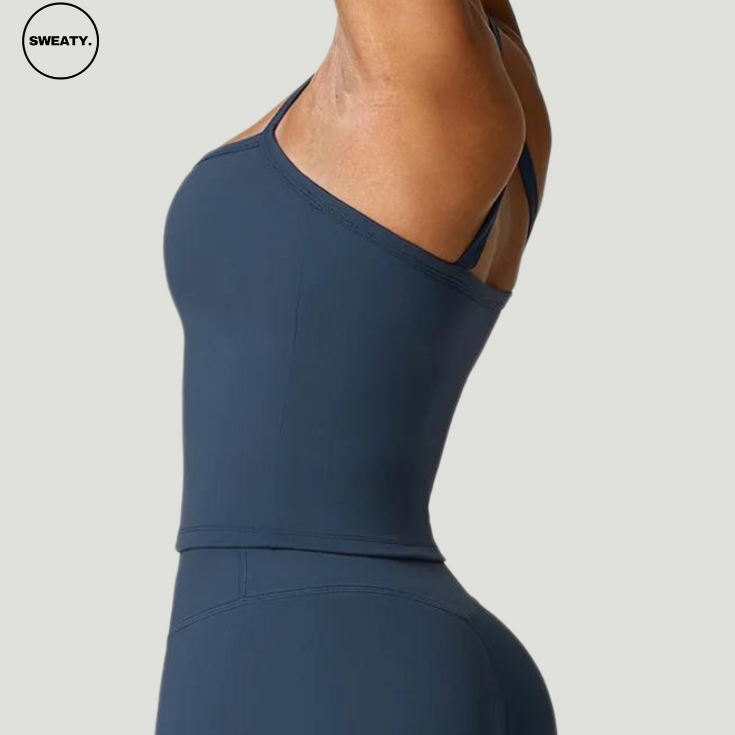 Side view of the Emblem Blue Push-Up Gym Bra Top by SWEATY - Women's gym top with moisture-wicking fabric, push-up support, and a body-hugging fit. Perfect for yoga, running, and fitness. Adjustable straps and breathable material provide all-day comfort.