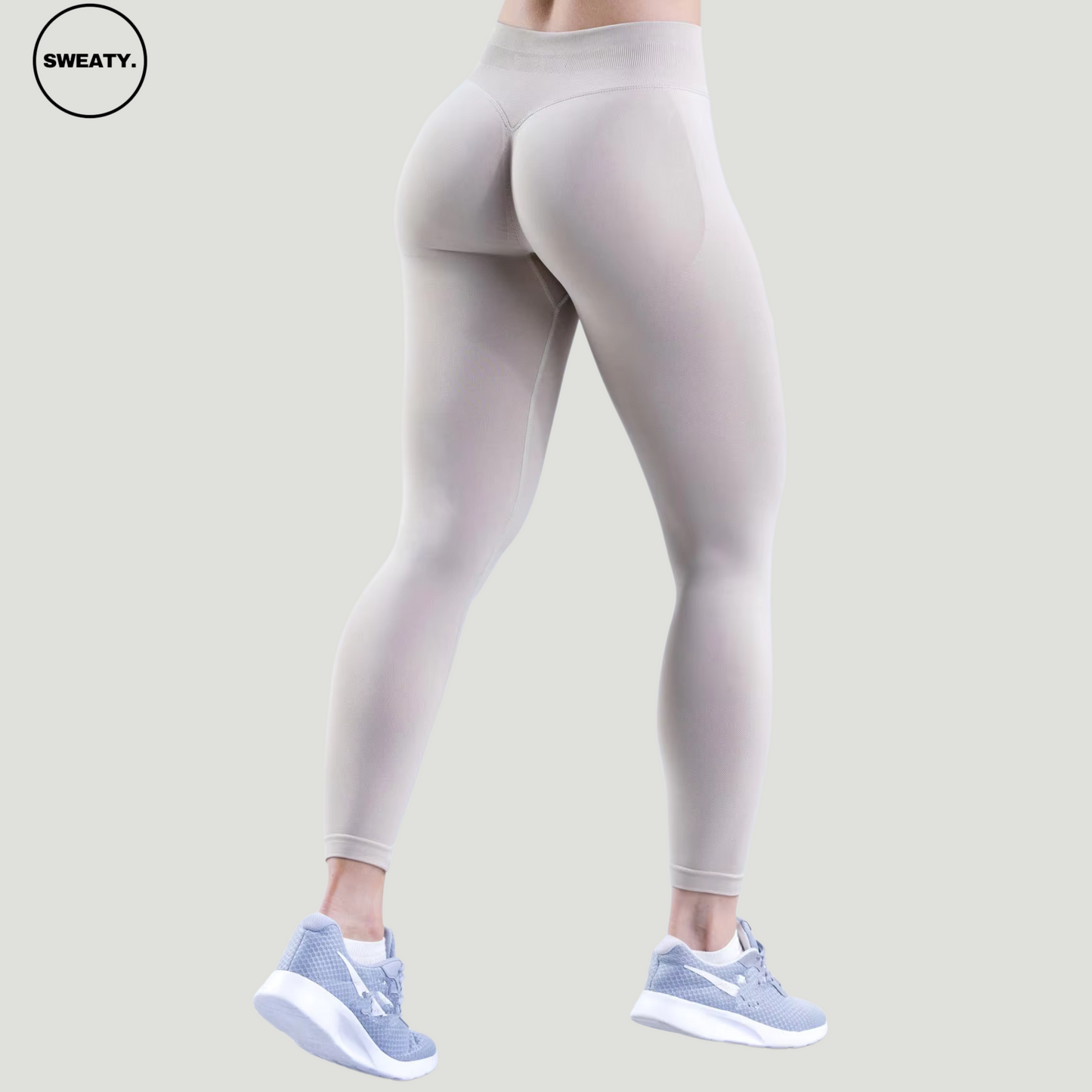 SWEATY Feather Beige High Waist Scrunch Butt Yoga Leggings, back angle view showcasing the seamless design and scrunch detail for enhanced fit.