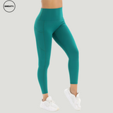 Forest Green Naked Feel Tummy Control Yoga Pants by SWEATY - Side view of high-waisted, body-hugging yoga pants with tummy control and side pockets. Designed for yoga and fitness activities, made from sweat-wicking, soft, and breathable fabric for maximum comfort.