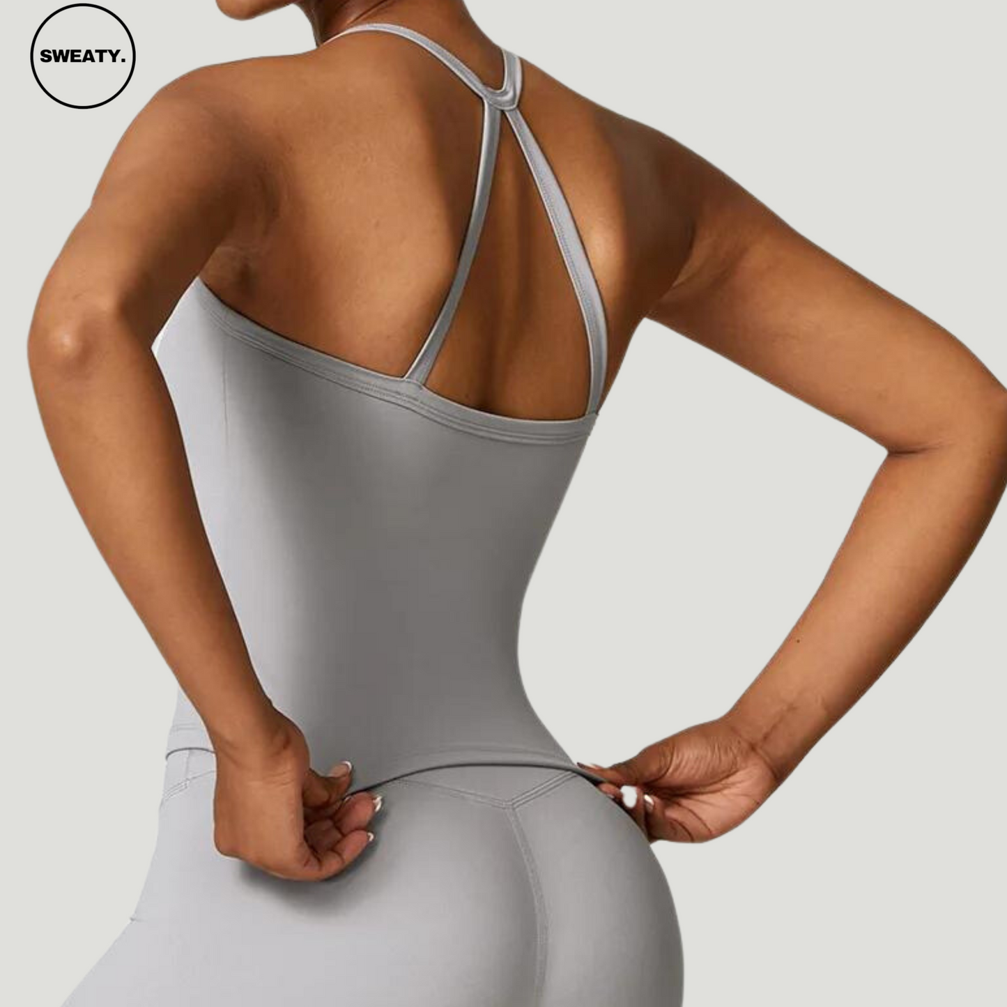 Back view of Frost Grey Push-Up Gym Bra Top by SWEATY - Women's activewear with a stylish strappy back design, made from moisture-wicking, breathable fabric. Ideal for high-intensity workouts, providing both comfort and support during gym and fitness activities.