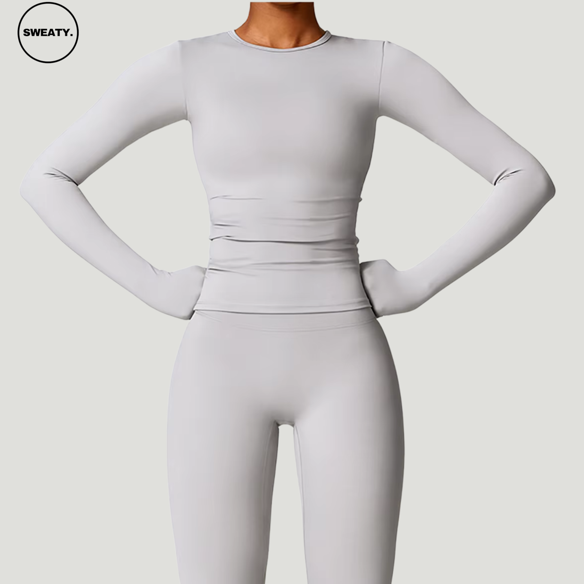 Frost Grey Seamless Activewear Set by SWEATY - High-performance yoga set with long sleeves, designed for maximum flexibility and comfort during workouts. Ideal for yoga, pilates, and general fitness activities.