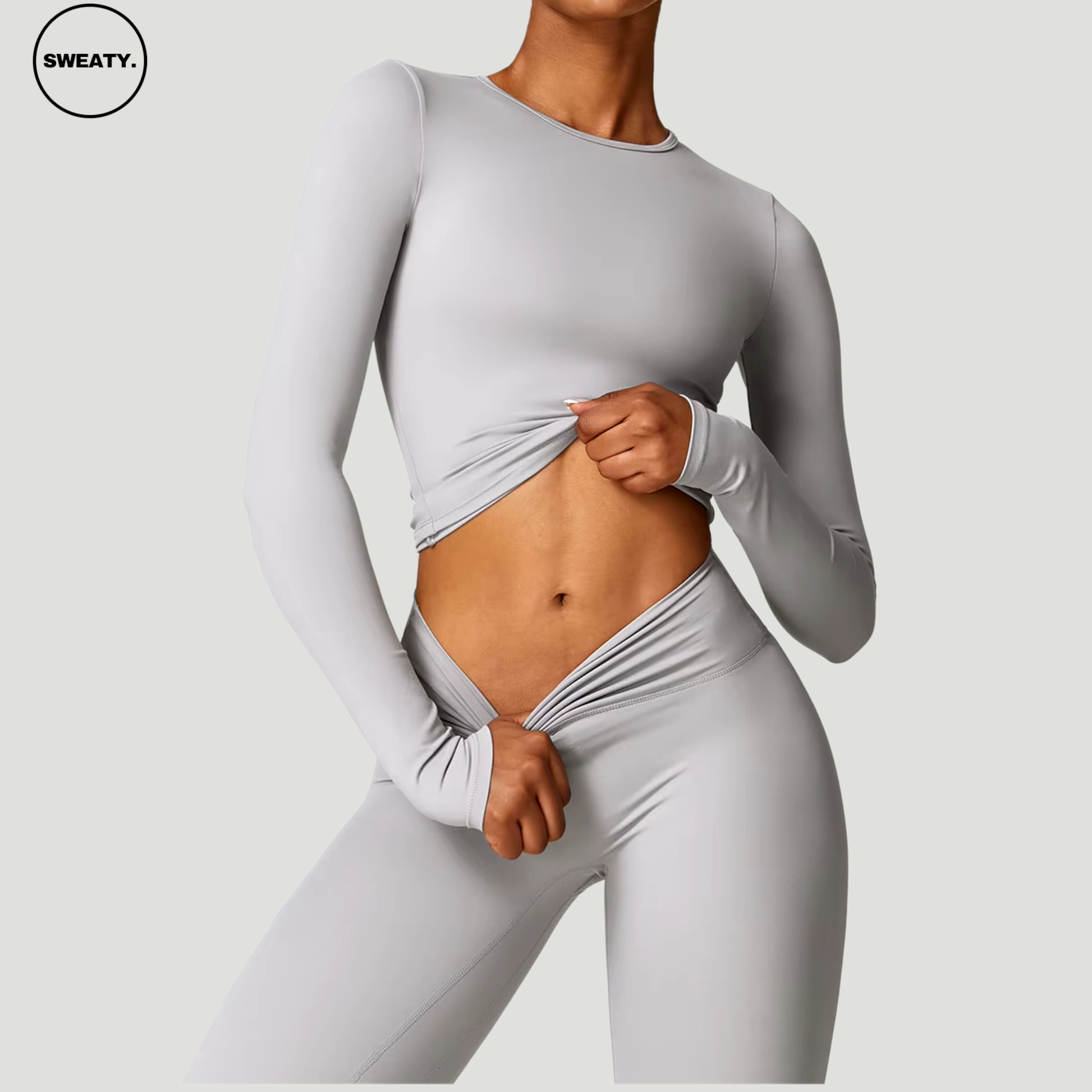 Frost Grey Yoga Set by SWEATY - Women's long-sleeve stretch top and seamless leggings. Perfect for yoga, fitness, and gym workouts with breathable, quick-drying fabric for optimal performance.