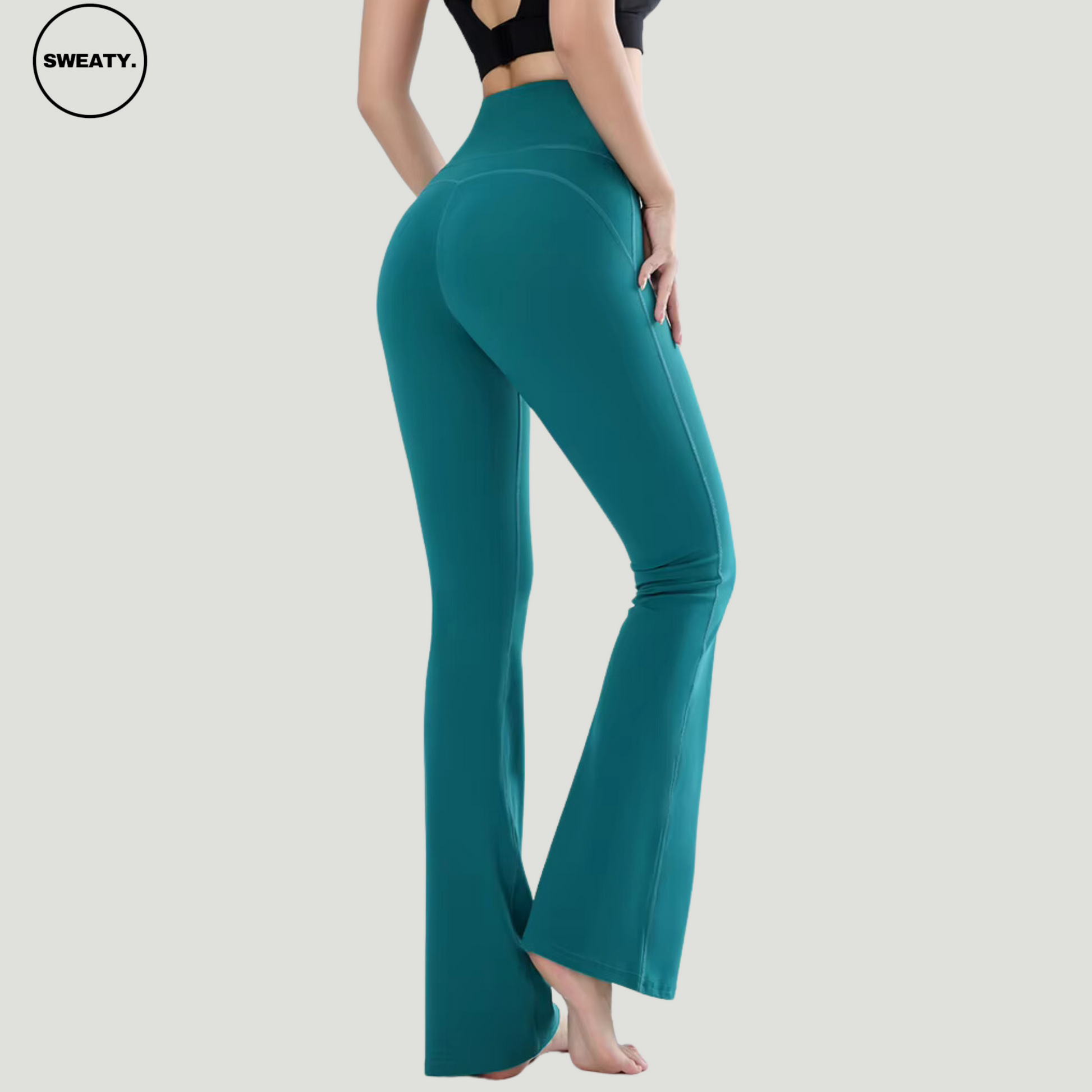 Green High Waist Slim Yoga Pants by SWEATY - Side view showing the high-rise waistband and body-contouring fit with flared legs. Designed for yoga, fitness, and everyday comfort with sweat-wicking, breathable fabric.