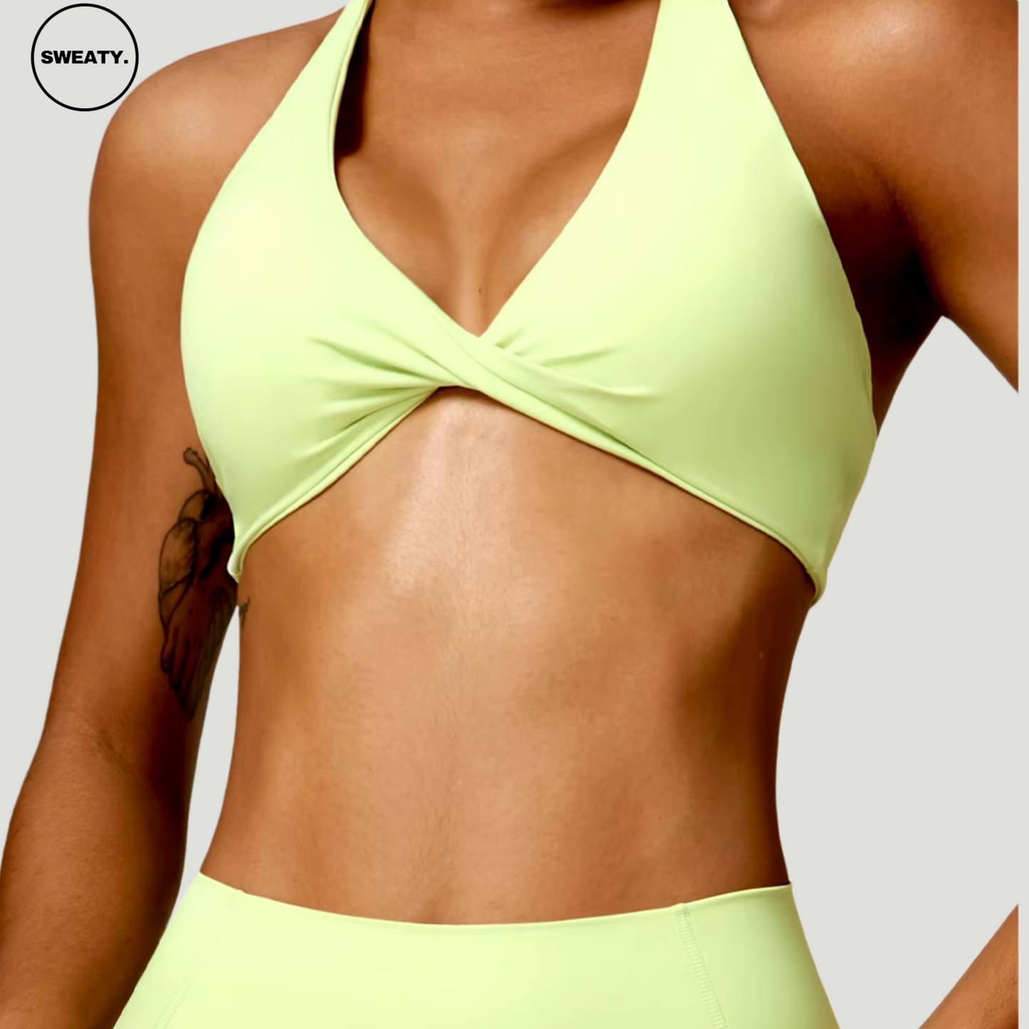 Green Nude Feeling Yoga Set by SWEATY - Women's form-fitting yoga bra and leggings designed for high mobility and comfort. Breathable SWEATY activewear with quick-dry technology perfect for yoga and fitness sessions.