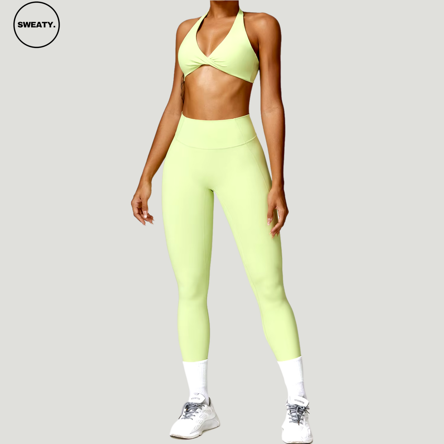 Green Nude Feeling Yoga Set by SWEATY - Women's supportive sports bra and high-waist leggings in vibrant green, ideal for the gym and daily workouts. SWEATY's moisture-wicking fabric ensures comfort and style during exercise.