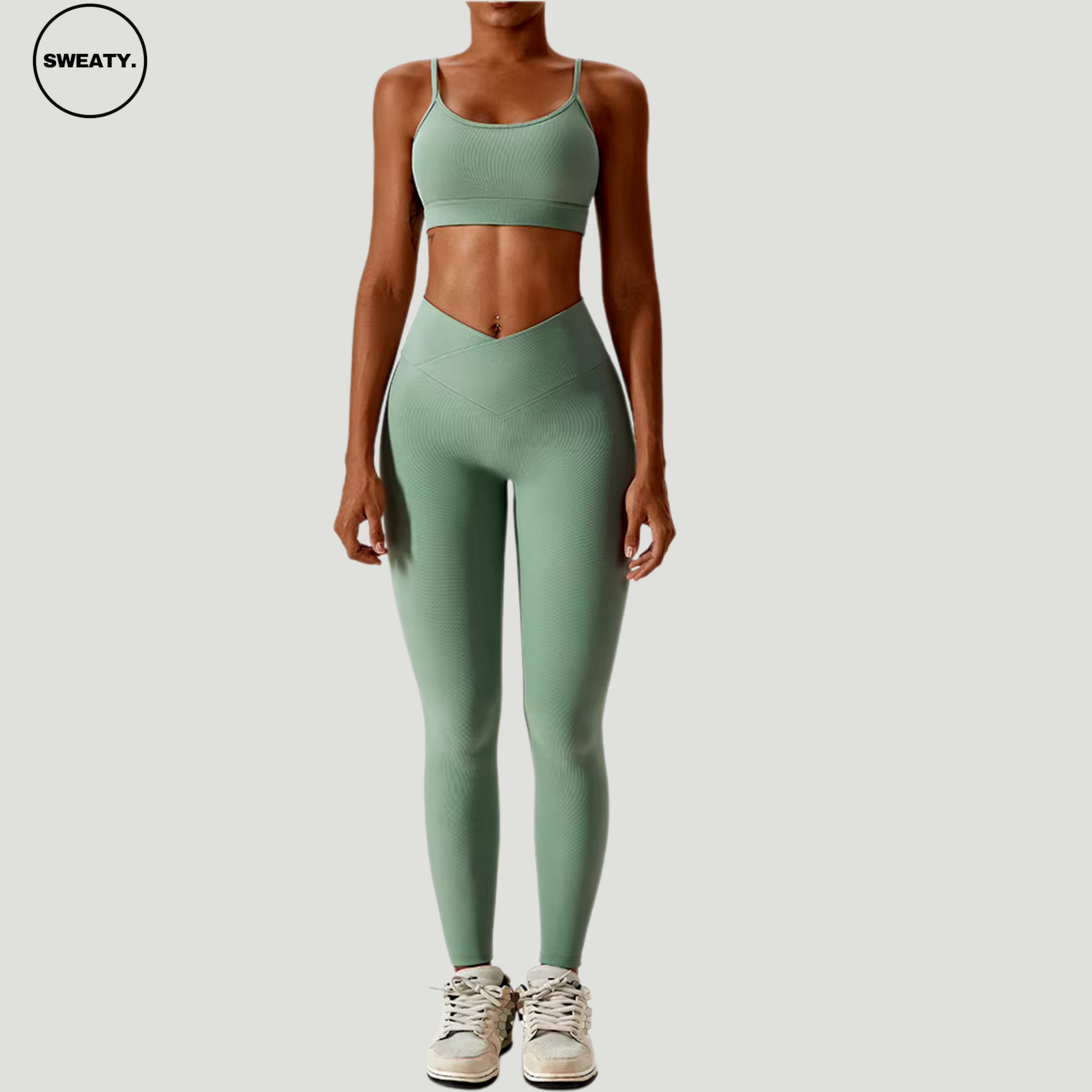 Green seamless sportswear set by SWEATY – full front view of the high-neck sports bra paired with high-waisted flare leggings. Perfect for yoga and gym workouts, with quick-dry, breathable fabric for performance and comfort.