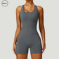 Grey seamless gym shortie jumpsuit by SWEATY - Women's full-body view showcasing a figure-hugging, breathable jumpsuit. Designed for high-performance workouts, this jumpsuit offers comfort and style with its seamless construction and flexible fit, ideal for gym sessions and fitness activities.