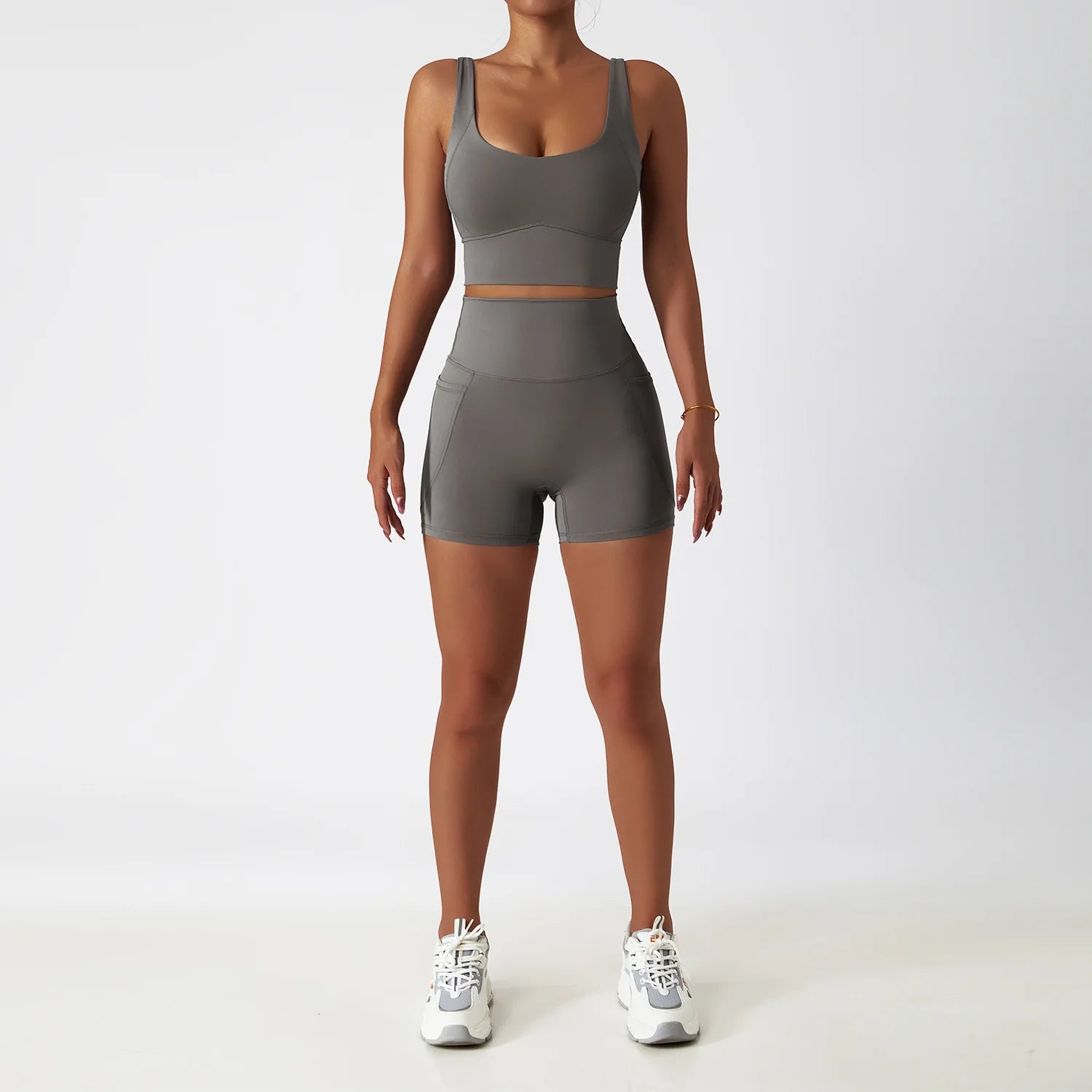 Grey seamless tracksuit set by SWEATY, designed with moisture-wicking technology. Ideal for women's fitness and yoga, offering a breathable and stretchy fit for comfortable performance.