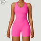 Hot pink seamless gym shortie jumpsuit by SWEATY - Women's front close-up view showing the vibrant, seamless fabric and athletic fit. Designed for intense workouts, this jumpsuit provides maximum comfort with its moisture-wicking, flexible material.