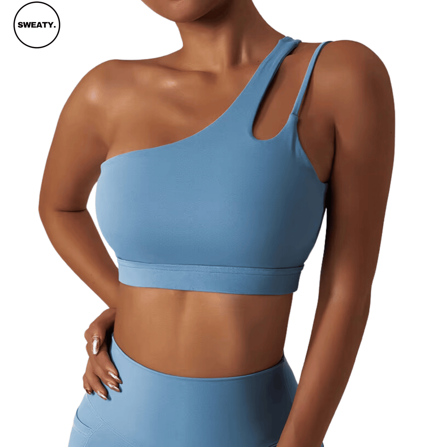 Side view of a light blue Asymmetrical Double Strap Sports Bra by SWEATY, featuring a unique one-shoulder design with cut-out details, providing a stylish and supportive fit for activewear.