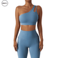 Front view of a light blue Asymmetrical Double Strap Sports Bra by SWEATY, featuring a stylish one-shoulder design with cut-out details, offering both comfort and support for activewear.