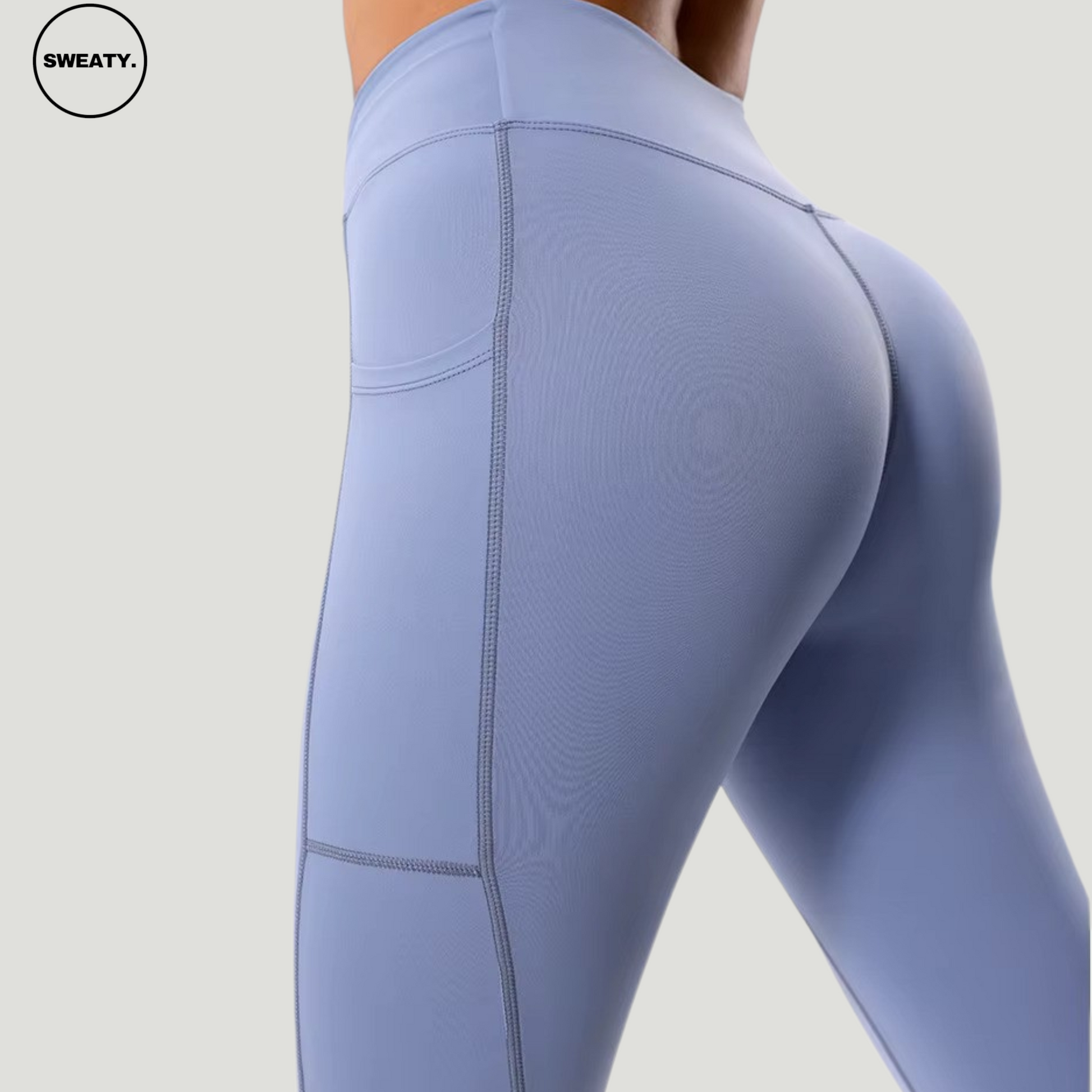 Back view of the Light Blue Hips Yoga Legging by SWEATY, highlighting the high-waisted fit and contour-enhancing seams. The leggings feature a supportive, snug fit with stylish side pocket detailing, ideal for both gym sessions and everyday wear.