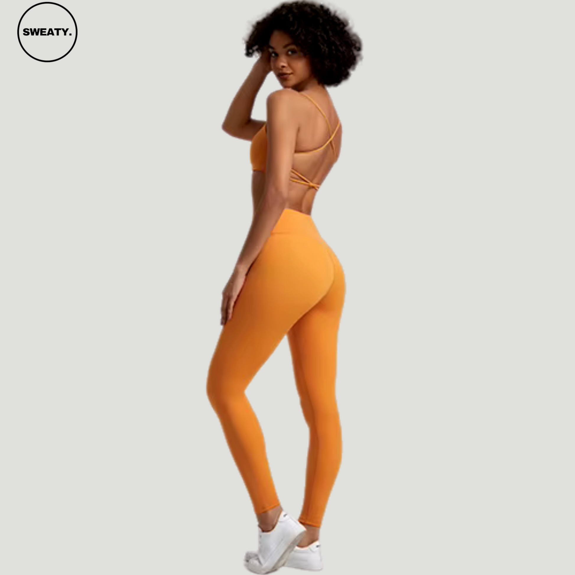 Mulberry Orange Buttery Soft Gym Set by SWEATY - Women's bold and vibrant mulberry orange leggings and sports bra, featuring an elegant cross-back design for enhanced support and style during fitness activities. Perfect for those looking to stand out in the gym with both color and performance.