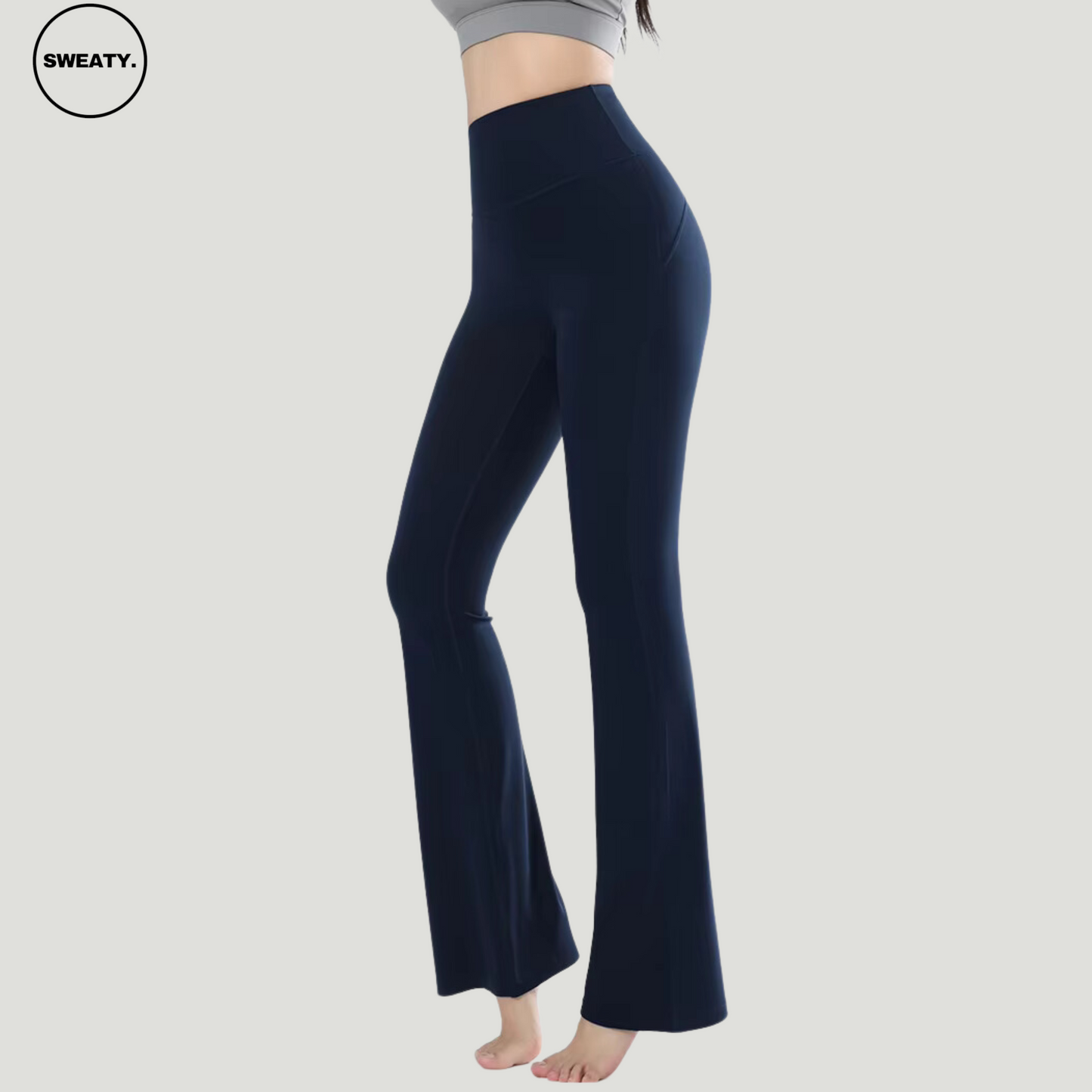 Navy Blue High Waist Slim Yoga Pants by SWEATY - Side view showcasing the flattering high-waisted fit and flared design. Ideal for yoga, fitness, and casual wear. Made from moisture-wicking, breathable fabric for maximum comfort during workouts.