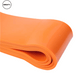 Close-up of an orange fitness resistance band. High-quality and durable, suitable for strength, flexibility, and resistance training. Ideal for versatile workouts at home or in the gym. SWEATY fitness equipment.