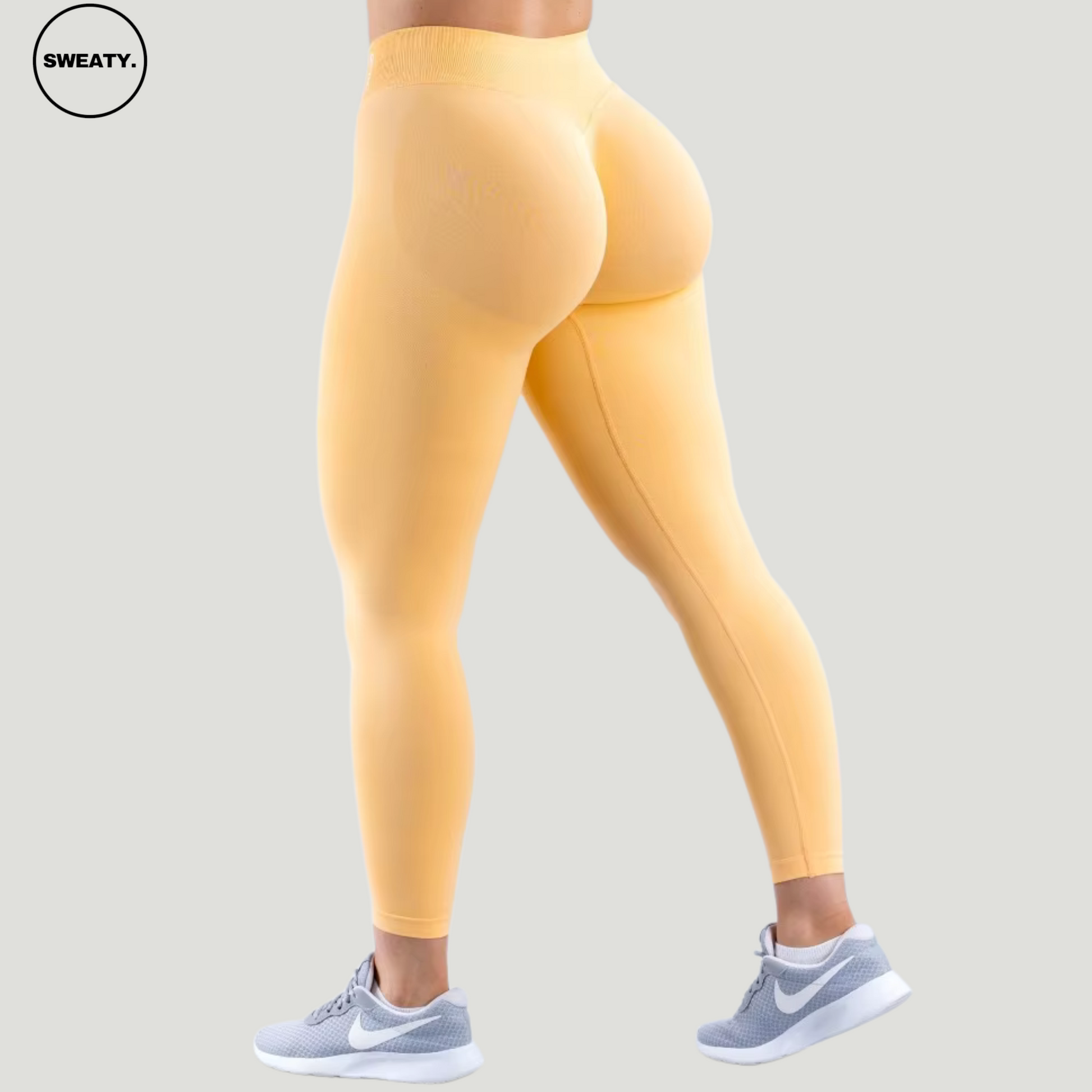 SWEATY Peach Sorbet High Waist Scrunch Butt Yoga Leggings, back view highlighting the scrunch detail and high-rise waistband for a sculpted silhouette.