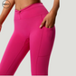 Close-up view of the Pink Hips Yoga Legging by SWEATY, showcasing the high-waist design with side pockets for convenience and functionality. The vibrant pink color adds a stylish pop to any activewear collection.