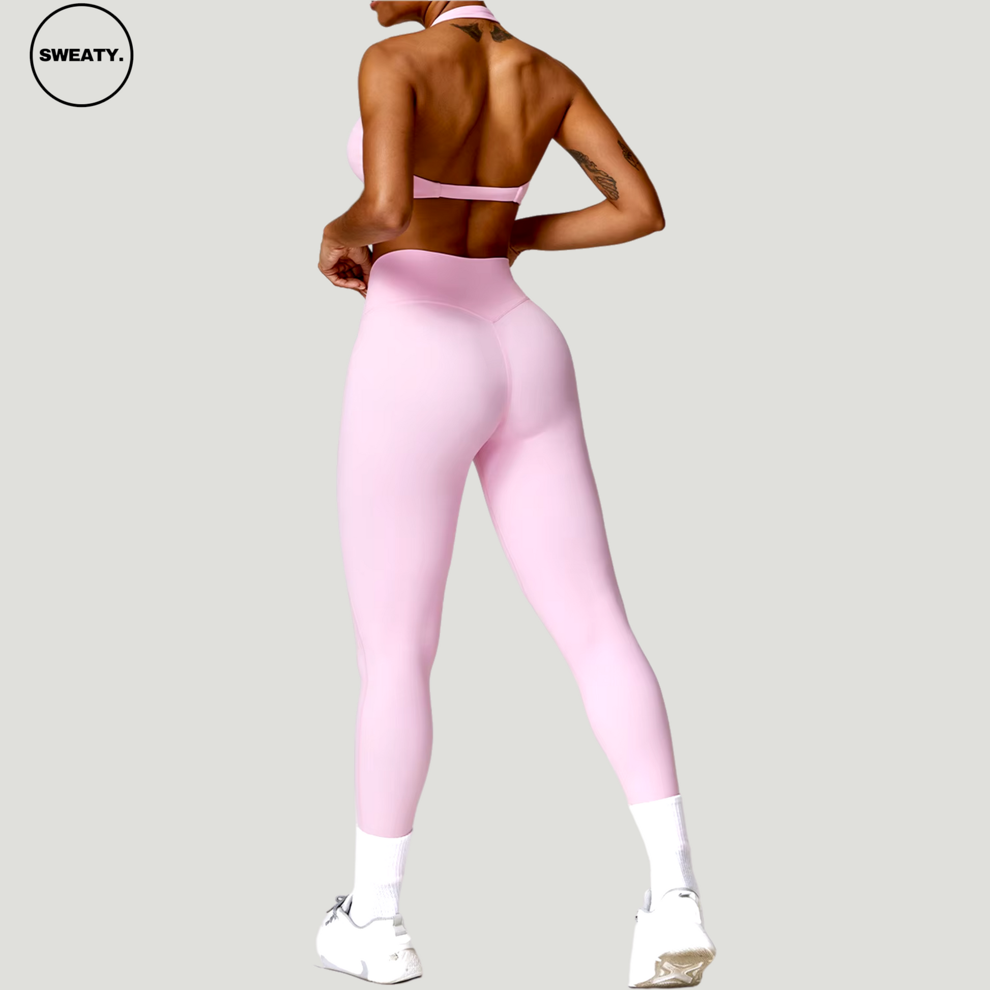 Pink Nude Feeling Yoga Set by SWEATY - Women's sleek, form-fitting yoga leggings and sports bra featuring a high-waisted design for full coverage and support during workouts. The set offers a flattering silhouette and flexible movement, ideal for yoga and gym sessions.