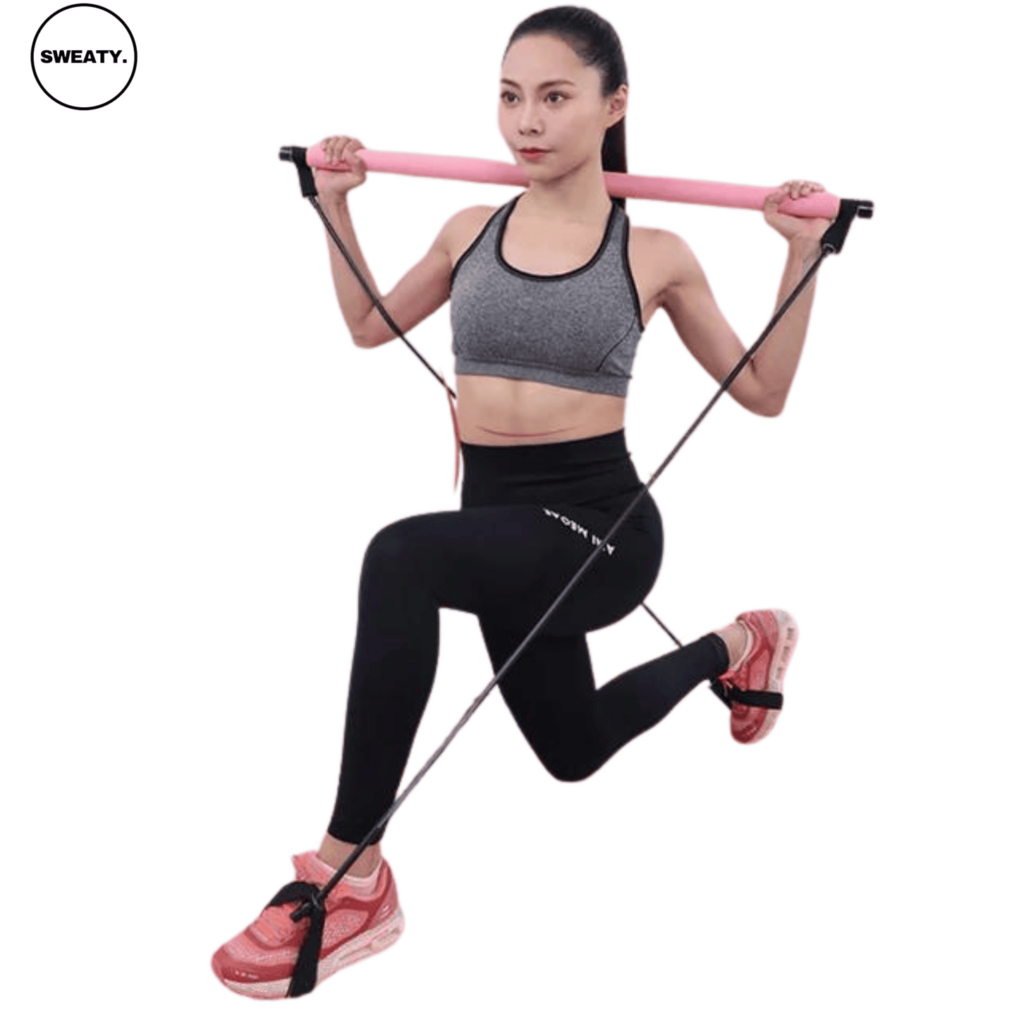 Front angle view of a woman performing lunges with the pink portable resistance bar set by SWEATY, highlighting its versatility for full-body workouts.